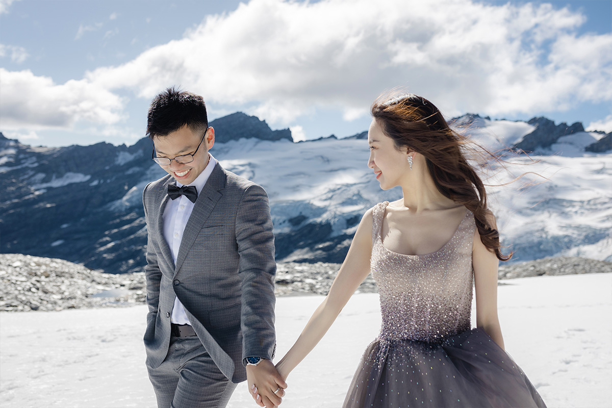 Enchanting Pre-Wedding Photoshoot in Queenstown, New Zealand: Vintage Car, White Horse, and Helicopter amidst Snow-Capped Mountains by Fei on OneThreeOneFour 15
