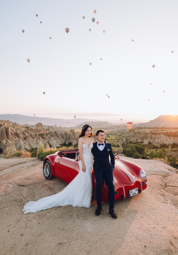 Cappadocia Pre-Wedding Photoshoot Hot Air Balloons Red Convertible Cave Hotel Roof Turkish Fairy Lamps Salt Lake