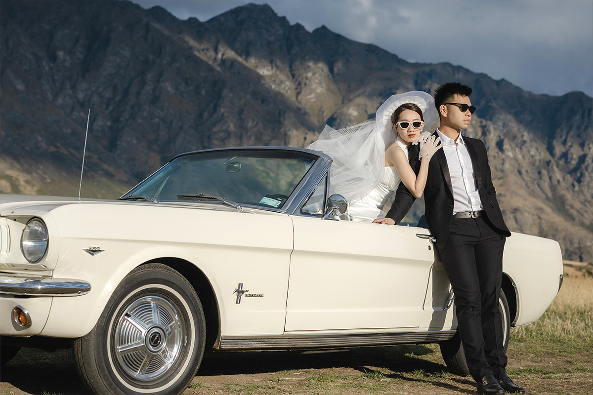 Enchanting Pre-Wedding Photoshoot in Queenstown, New Zealand: Vintage Car, White Horse, and Helicopter amidst Snow-Capped Mountains by Fei on OneThreeOneFour 5