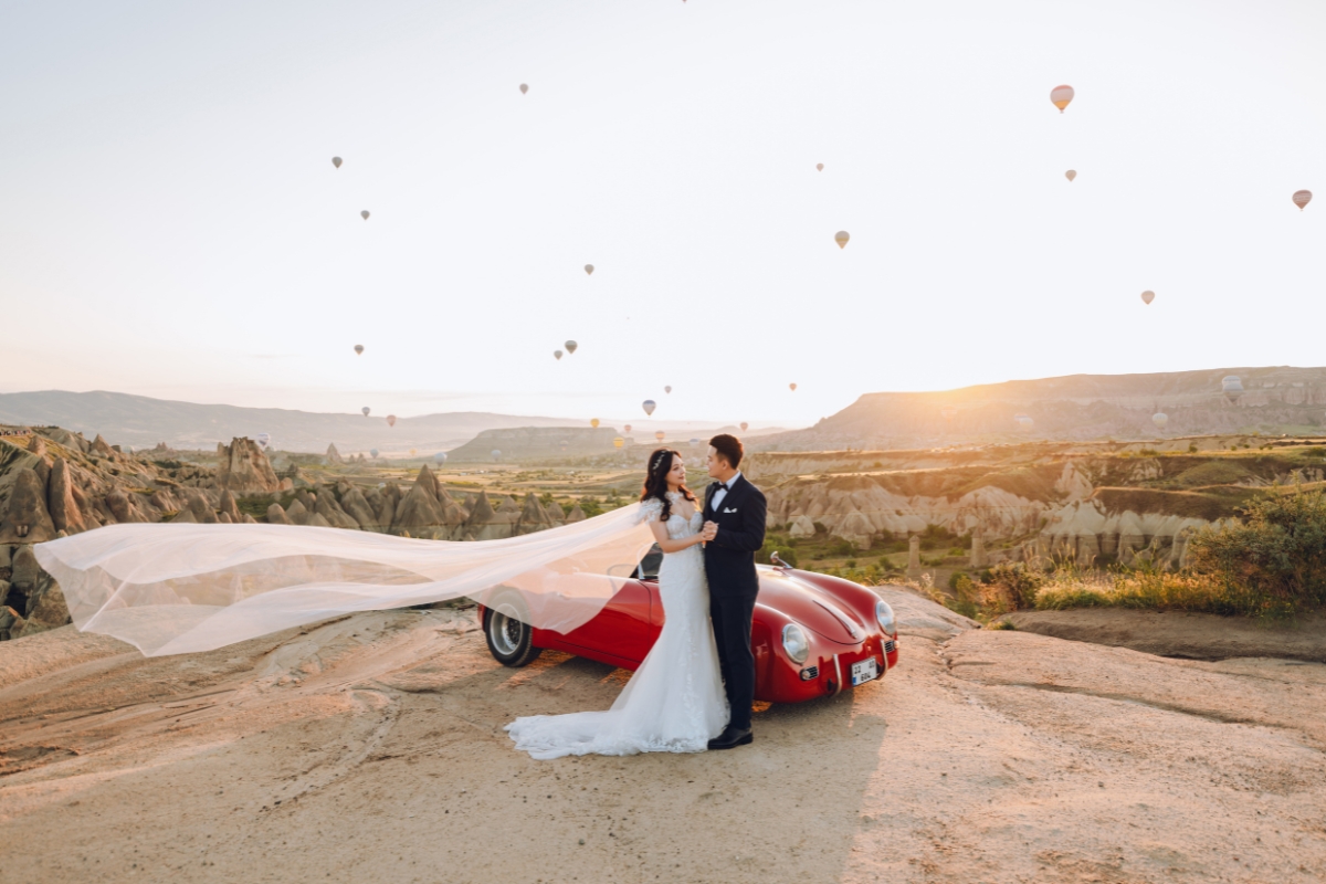 Cappadocia Pre-Wedding Photoshoot Hot Air Balloons Red Convertible Cave Hotel Roof Turkish Fairy Lamps Salt Lake by Aric on OneThreeOneFour 0