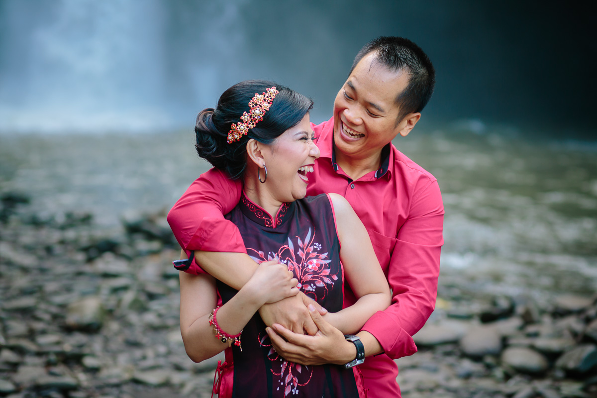 Vietnamese couple relax in waterfall and beach Ferry