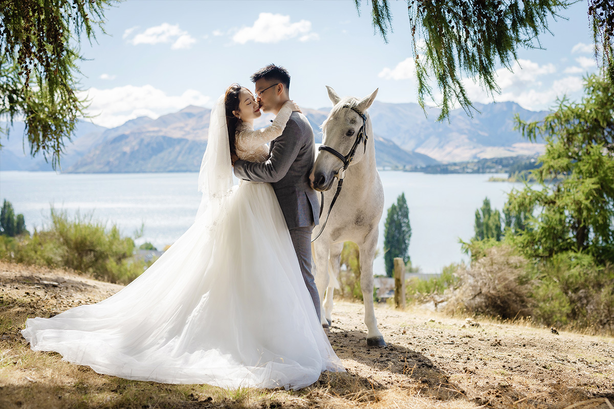 Enchanting Pre-Wedding Photoshoot in Queenstown, New Zealand: Vintage Car, White Horse, and Helicopter amidst Snow-Capped Mountains by Fei on OneThreeOneFour 0