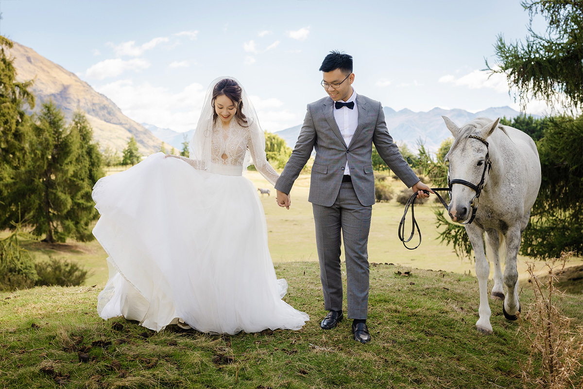Enchanting Pre-Wedding Photoshoot in Queenstown, New Zealand: Vintage Car, White Horse, and Helicopter amidst Snow-Capped Mountains by Fei on OneThreeOneFour 2