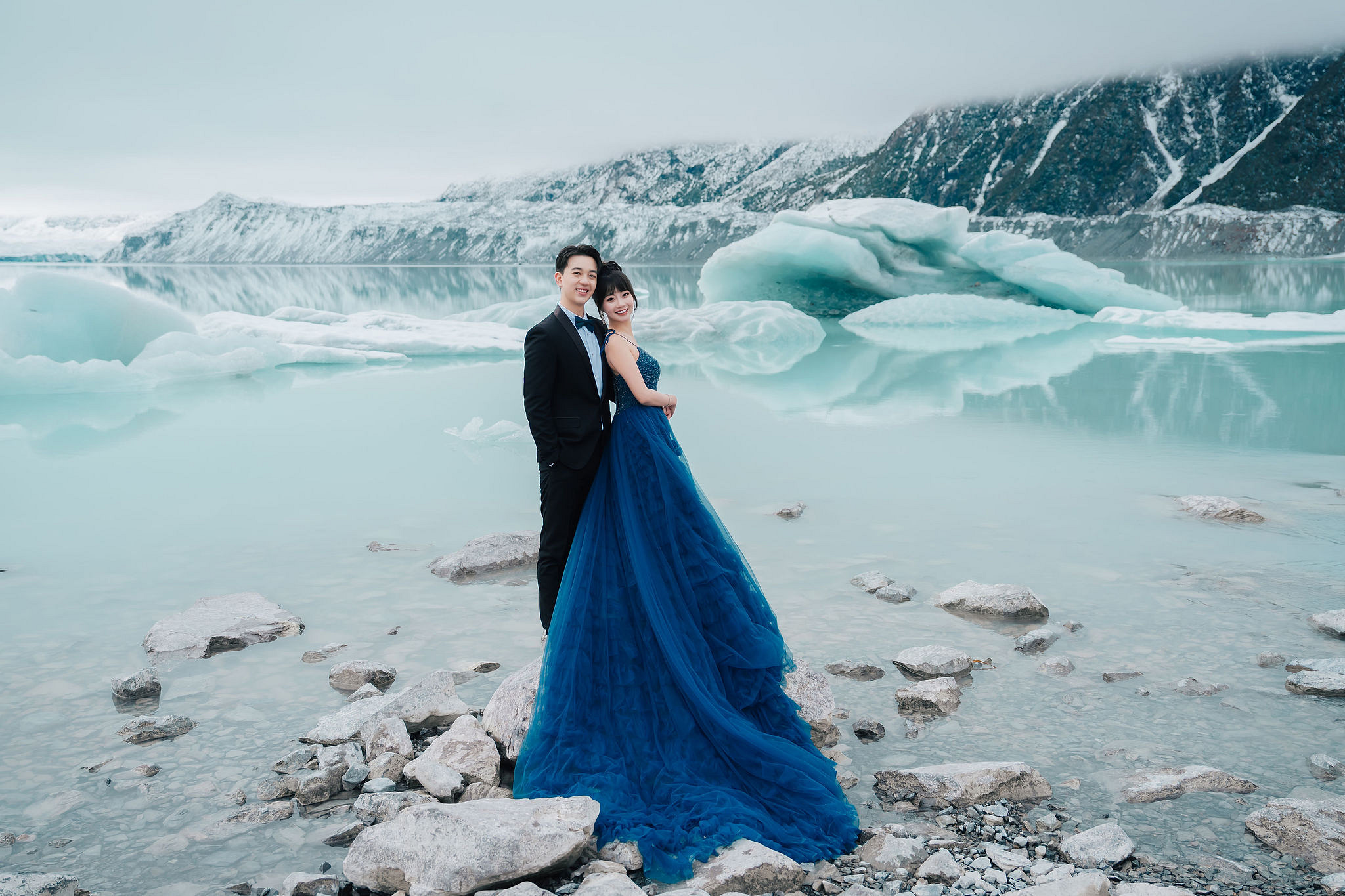 New Zealand Pre-Wedding Photoshoot | Lake Wakatipu, Fog Peak, Lake Tekapo, Glacier & Mount Cook National Park at Glacier pre-wedding photo