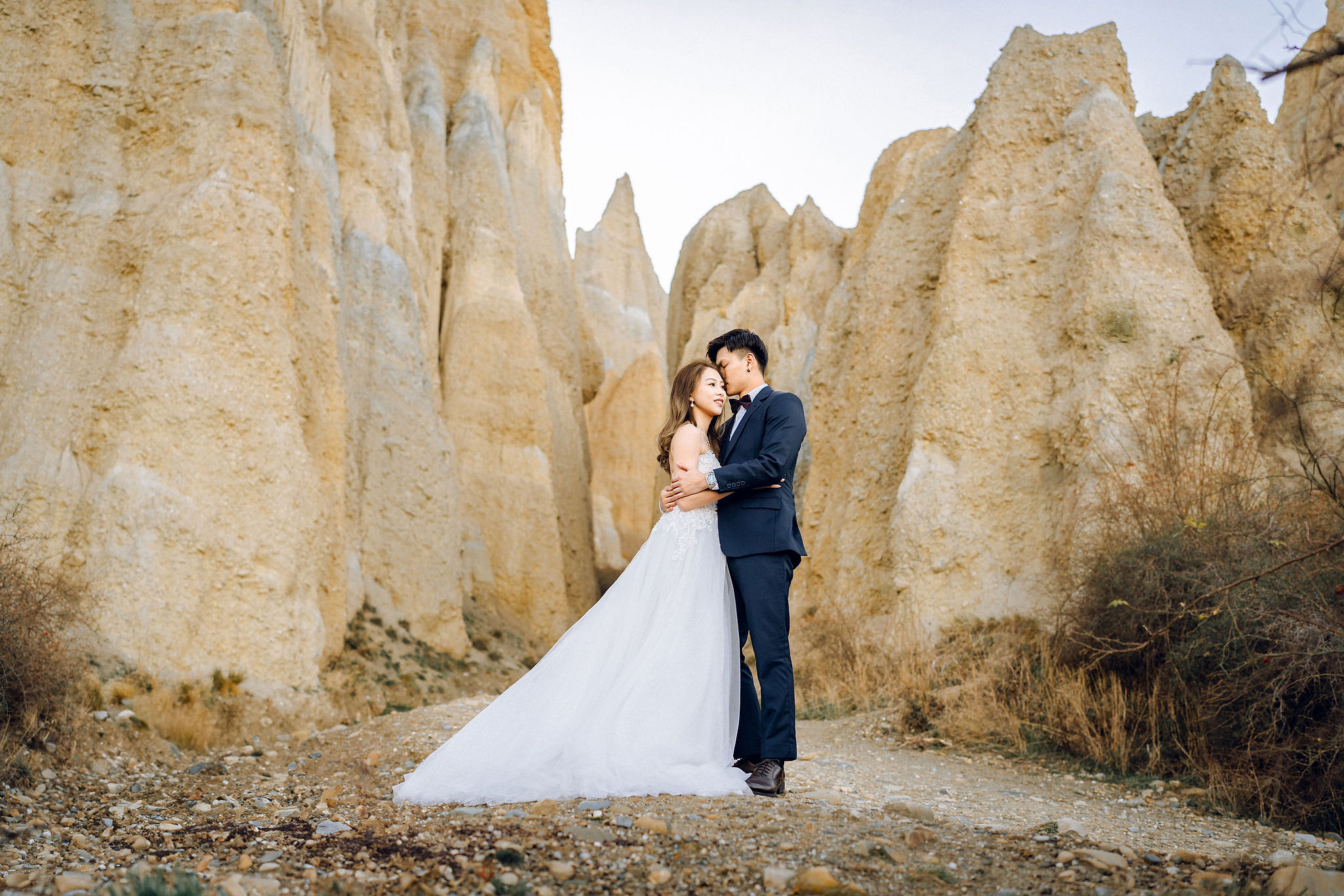 New Zealand Pre-Wedding Photoshoot | Alpaca Farm, Mt John, Lake Tekapo, Mount Cook National Park, Glacier Lake & Omarama Clay Cliffs at Omarama Clay Cliffs pre-wedding photo