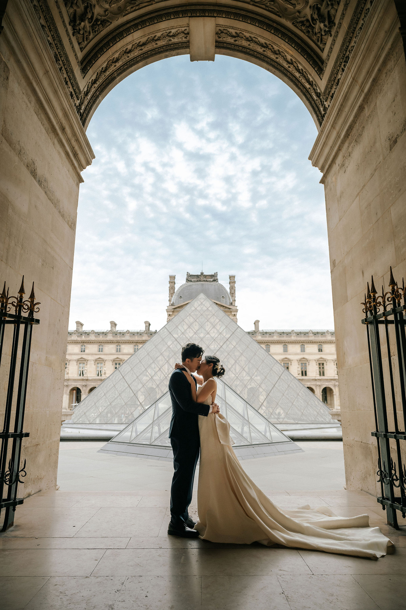 Paris Pre-Wedding Photoshoot | Place du Trocadéro, Bir-Hakeim Bridge, Louvre Pyramid, Tuileries Garden & Montmartre at Louvre Pyramid pre-wedding photo
