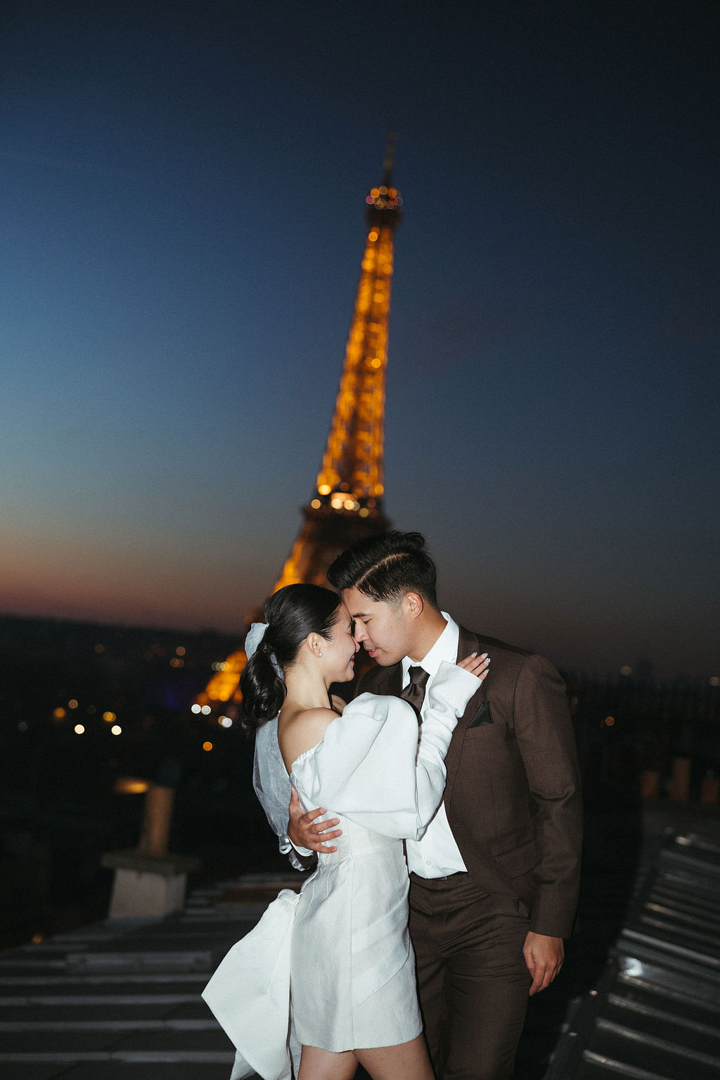 Paris Pre-Wedding Photoshoot with Eiﬀel Tower Louvre Museum Parisian Cafe Vintage Car Rooftop Night at Paris Rooftop pre-wedding photo