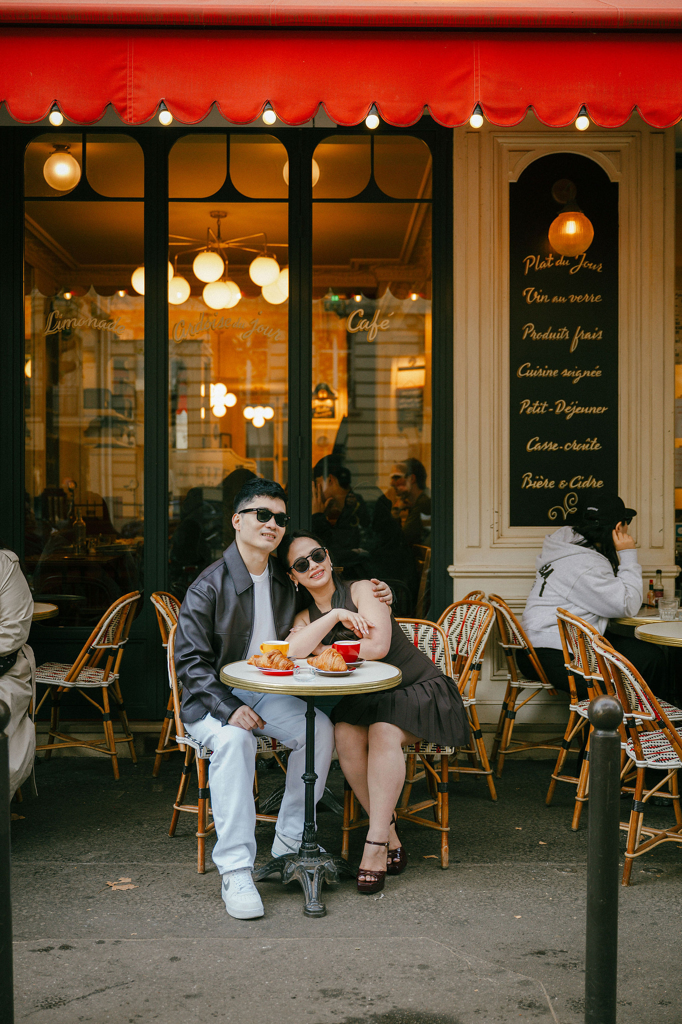 Paris Pre-Wedding Photoshoot | Trocadéro, Vintage Car, Parisian Café, Paris Rooftop & Louvre at Parisian Café pre-wedding photo