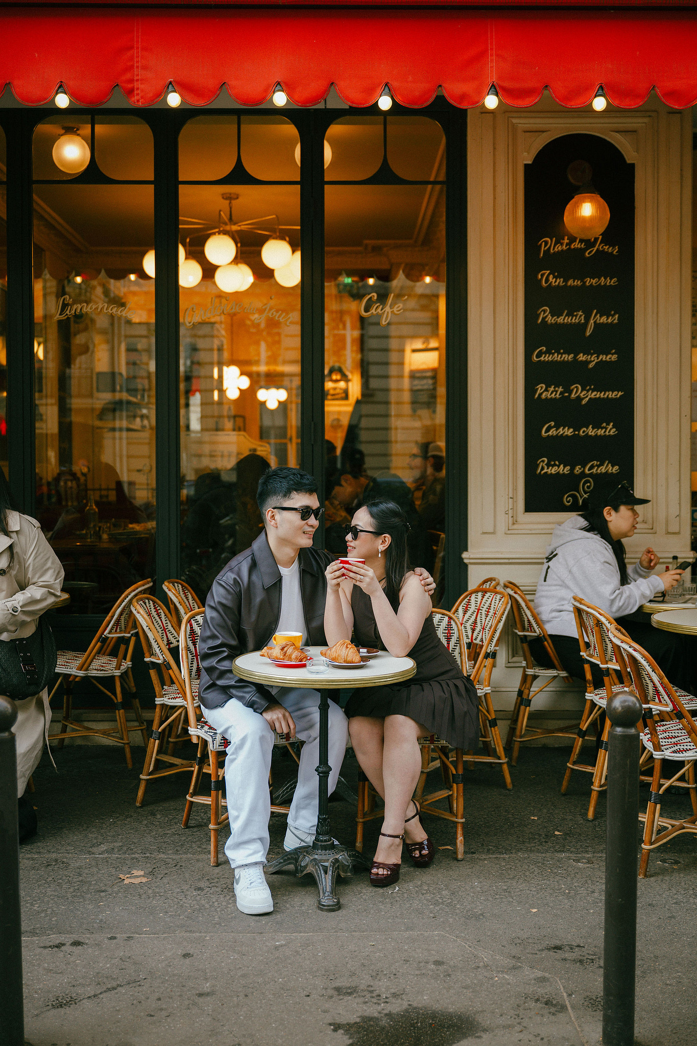 Paris Pre-Wedding Photoshoot | Trocadéro, Vintage Car, Parisian Café, Paris Rooftop & Louvre at Parisian Café pre-wedding photo