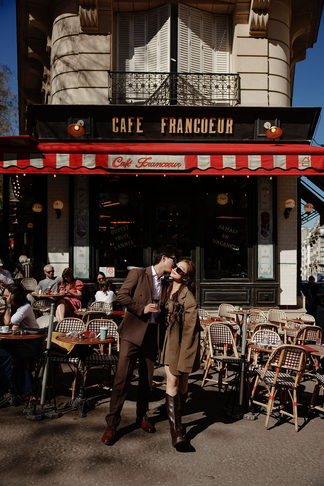 Paris Pre-Wedding Photoshoot | Place du Trocadéro, Bir-Hakeim Bridge, Sacré-Cœur Basilica, Parisian Café & Palais Royal at Parisian Café pre-wedding photo