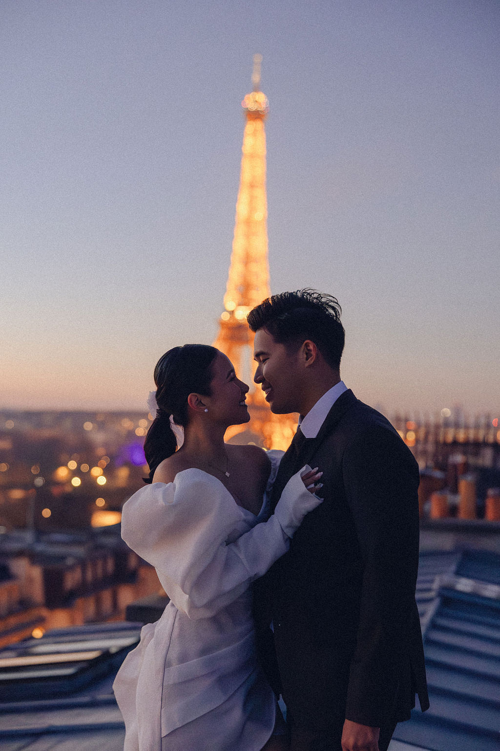 Paris Pre-Wedding Photoshoot with Eiﬀel Tower Louvre Museum Parisian Cafe Vintage Car Rooftop Night at Paris Rooftop pre-wedding photo