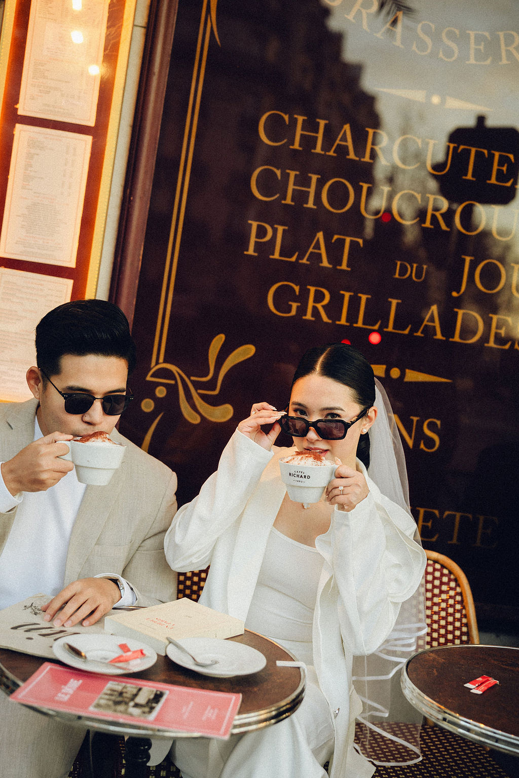 Paris Pre-Wedding Photoshoot with Eiﬀel Tower Louvre Museum Parisian Cafe Vintage Car Rooftop Night at Parisian Café pre-wedding photo