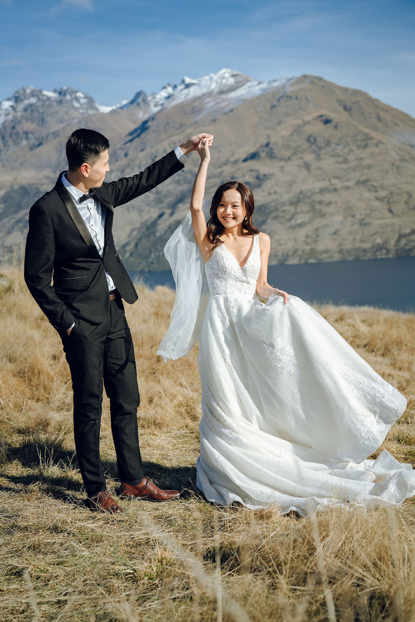 New Zealand Pre-Wedding Photoshoot with Lake Wakatipu, Skippers Canyon, Lake Tekapo, Mount Cook, and Omarama Clay Cliffs at Lake Wakatipu pre-wedding photo