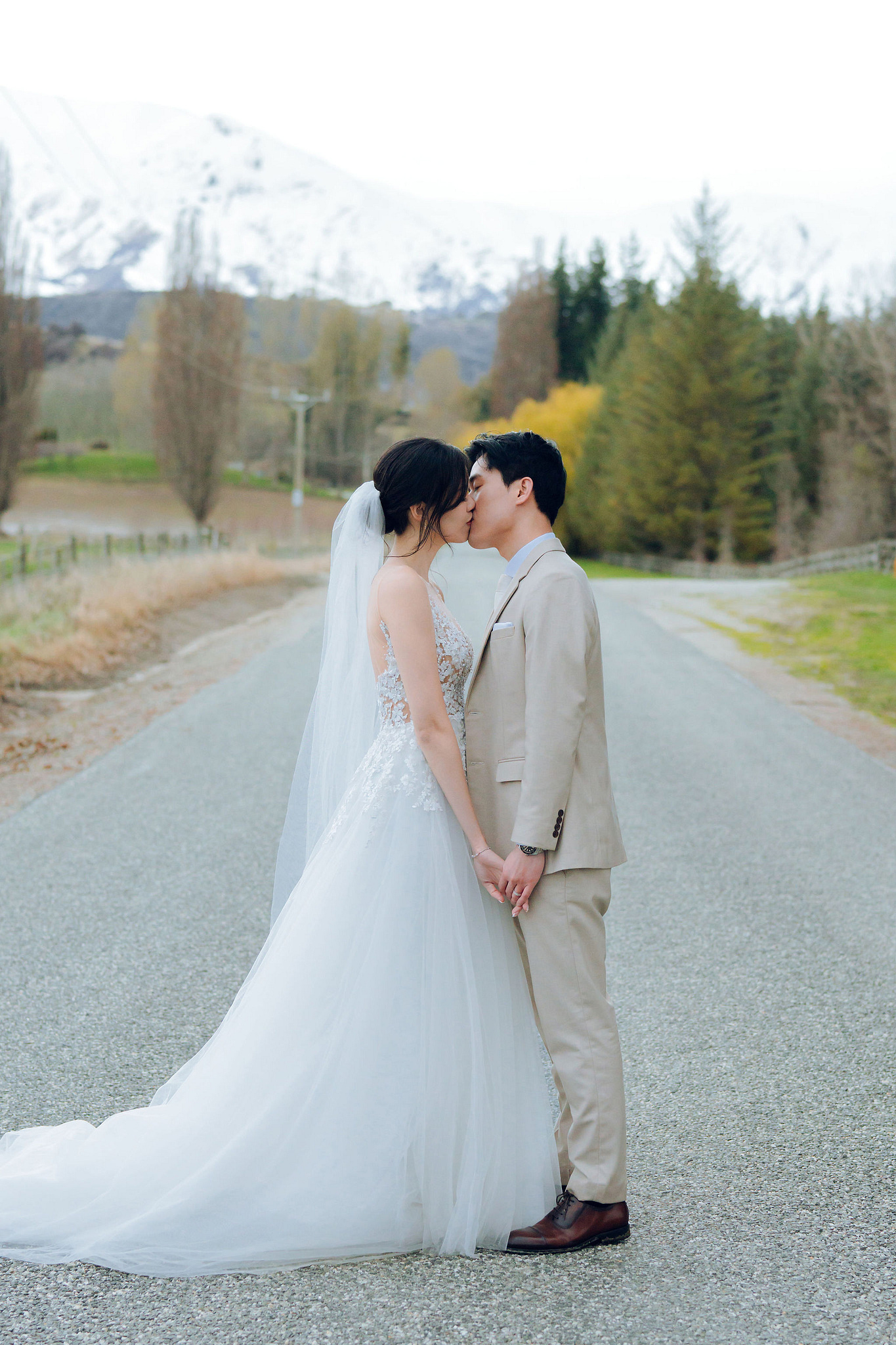 New Zealand Pre-Wedding Photoshoot | Cherry Blossoms, Coromandel Peak & Lake Wakatipu at Lake Wakatipu & Queenstown Highway pre-wedding photo