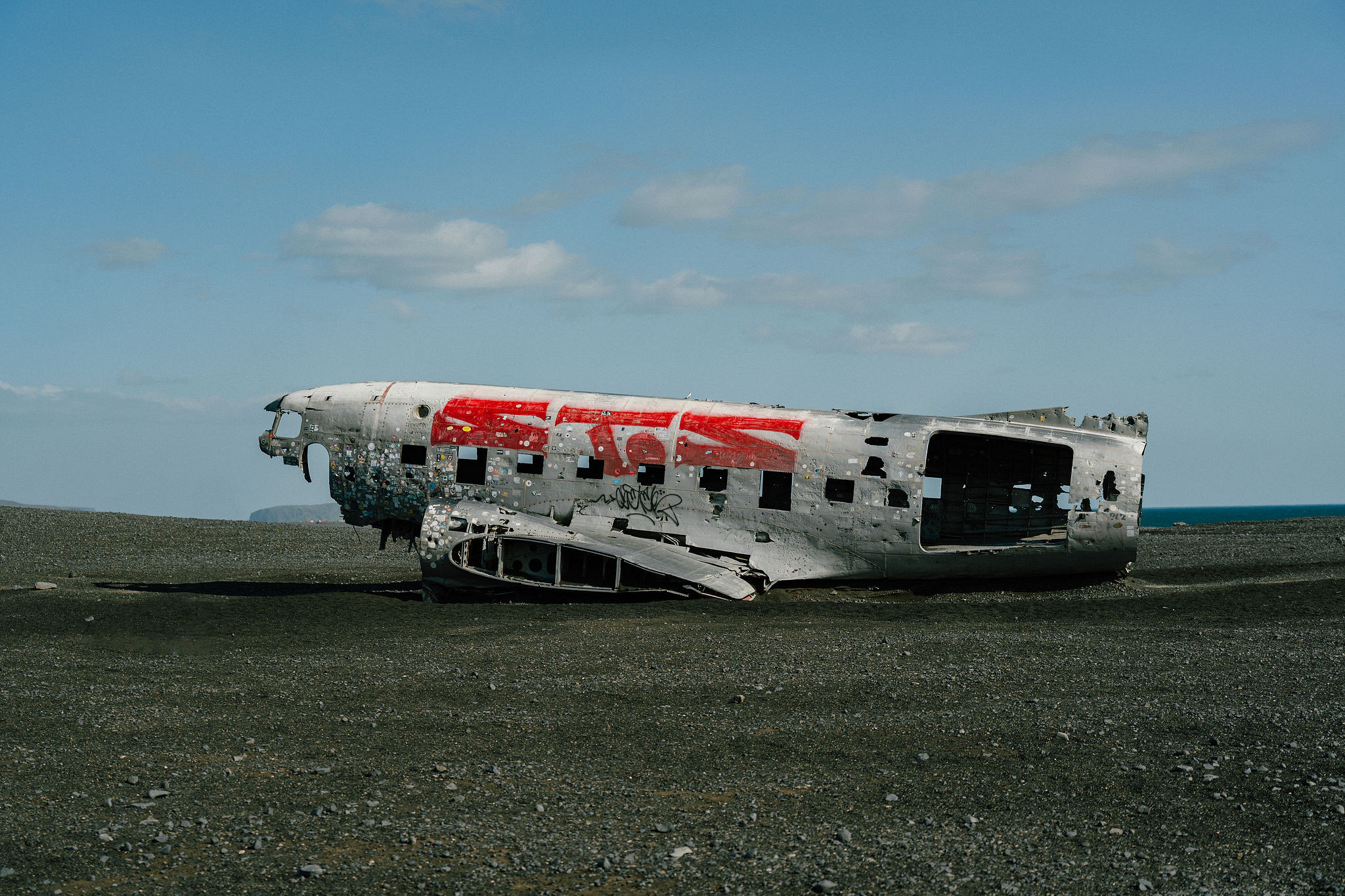Iceland Pre-Wedding Photoshoot | Hallgrimskirkja, Skogafoss, DC Plane Wreck & Black Sand Beach at DC Plane Wreck pre-wedding photo