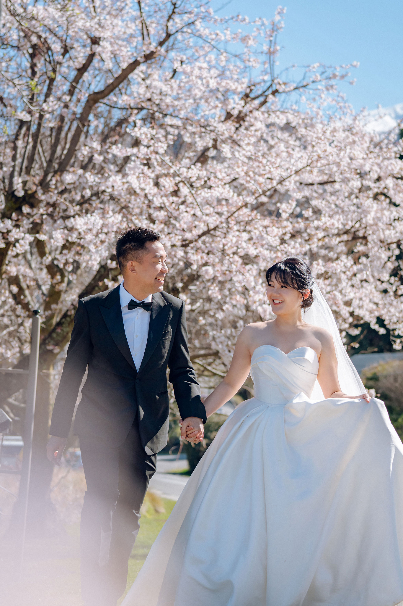 New Zealand Pre-Wedding Photoshoot | Lake Tekapo, Mount Cook, Tasman Glacier & Lake Wakatipu at Spring Blossom Path pre-wedding photo