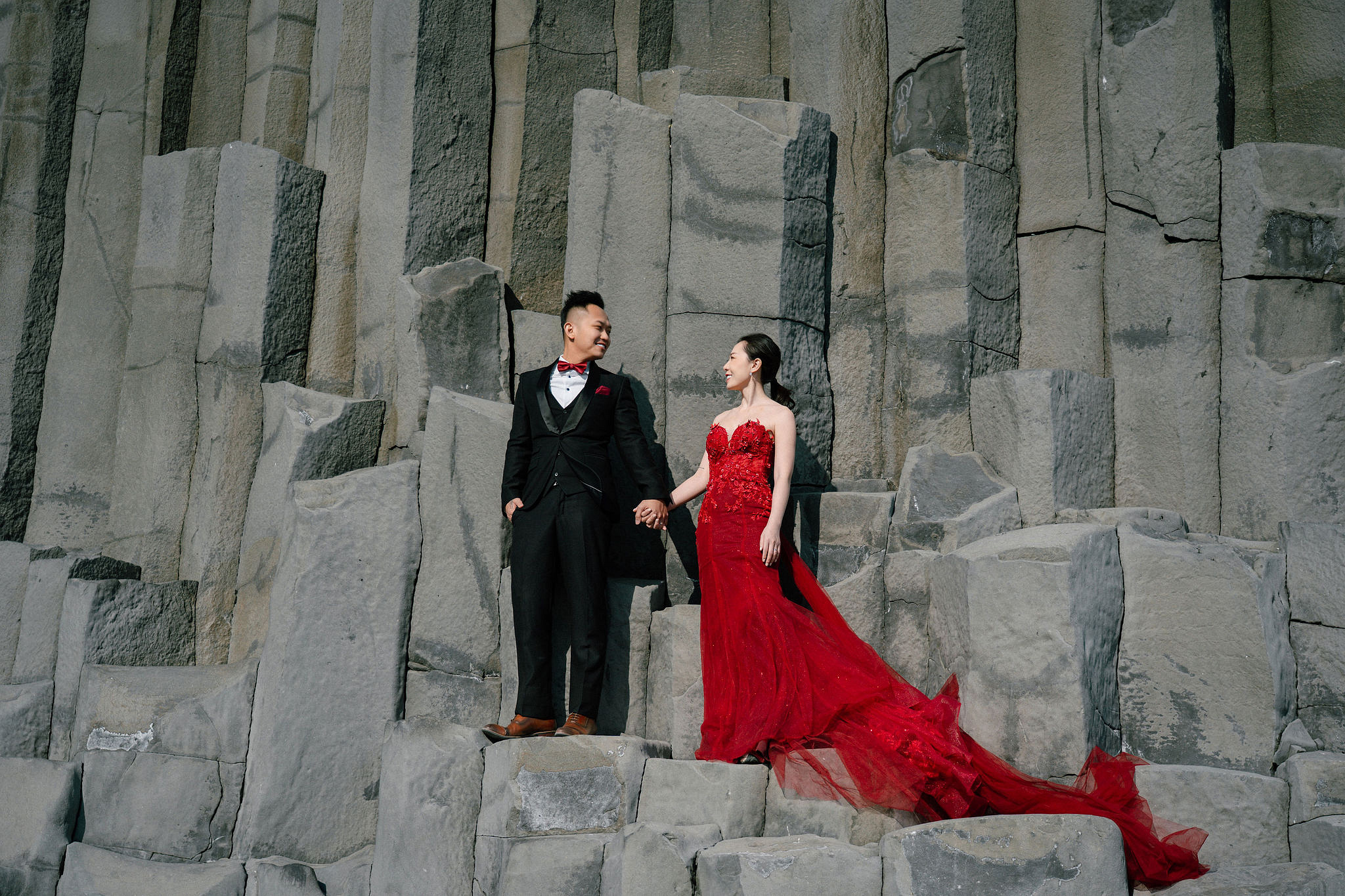 Iceland Pre-Wedding Photoshoot | Hallgrimskirkja, Skogafoss, DC Plane Wreck & Black Sand Beach at Black Sand Beach & Vik Church pre-wedding photo