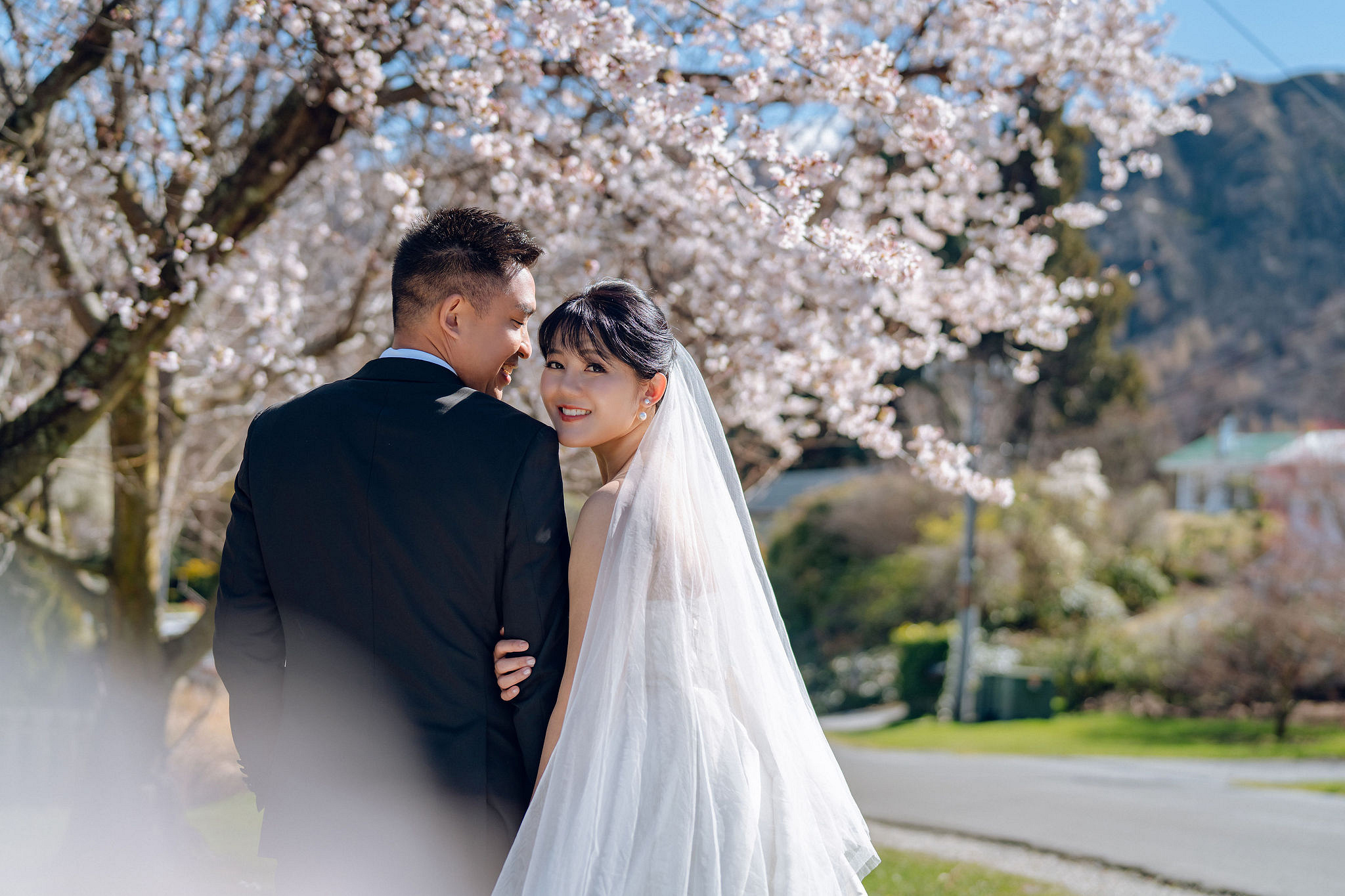 New Zealand Pre-Wedding Photoshoot | Lake Tekapo, Mount Cook, Tasman Glacier & Lake Wakatipu at Spring Blossom Path pre-wedding photo