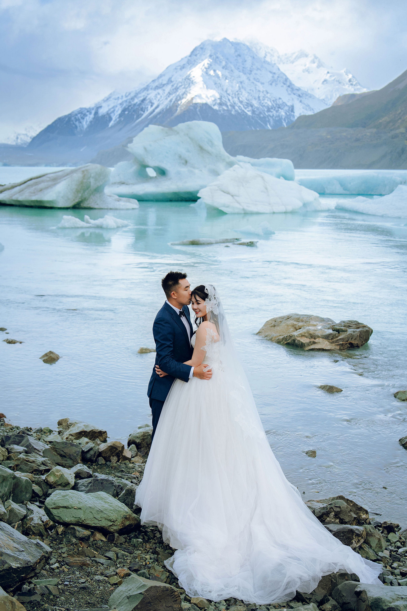 New Zealand Pre-Wedding Photoshoot | Lake Tekapo, Mount Cook, Tasman Glacier & Lake Wakatipu at Glacier Lake pre-wedding photo