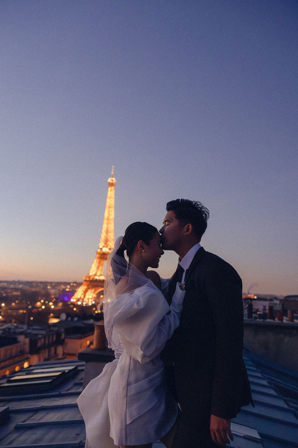 Paris Pre-Wedding Photoshoot with Eiﬀel Tower Louvre Museum Parisian Cafe Vintage Car Rooftop Night at Paris Rooftop pre-wedding photo