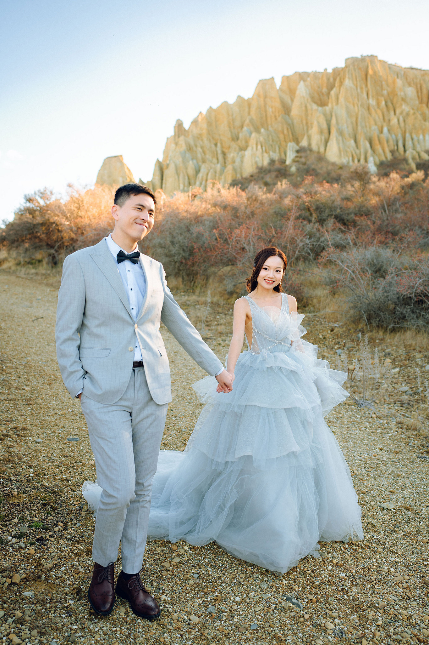 New Zealand Pre-Wedding Photoshoot with Lake Wakatipu, Skippers Canyon, Lake Tekapo, Mount Cook, and Omarama Clay Cliffs at Omarama Clay Cliffs pre-wedding photo