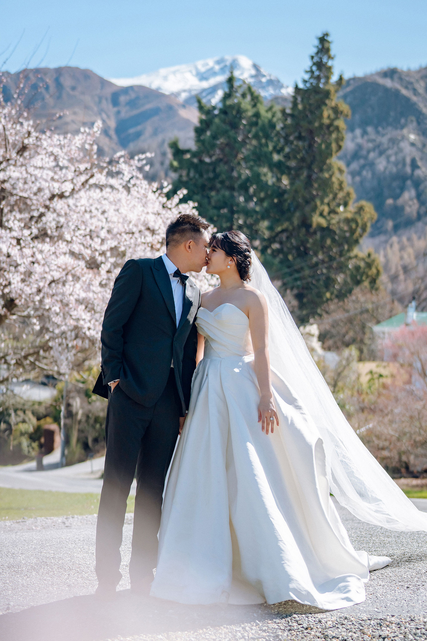 New Zealand Pre-Wedding Photoshoot | Lake Tekapo, Mount Cook, Tasman Glacier & Lake Wakatipu at Spring Blossom Path pre-wedding photo