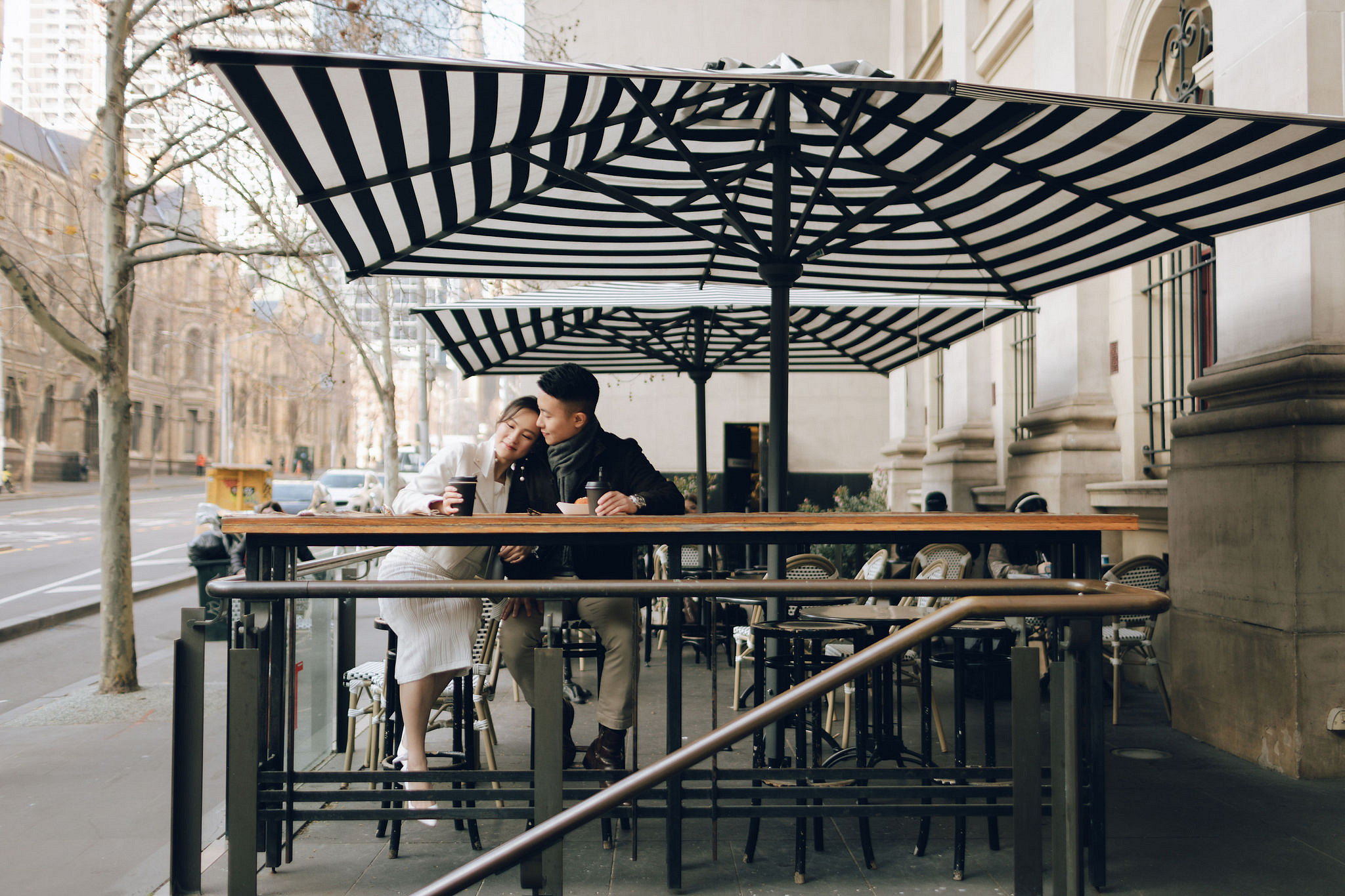 Melbourne Pre-Wedding Photoshoot | Cafe, Redwood Forest, City Streets & Carlton Gardens at City Cafe pre-wedding photo