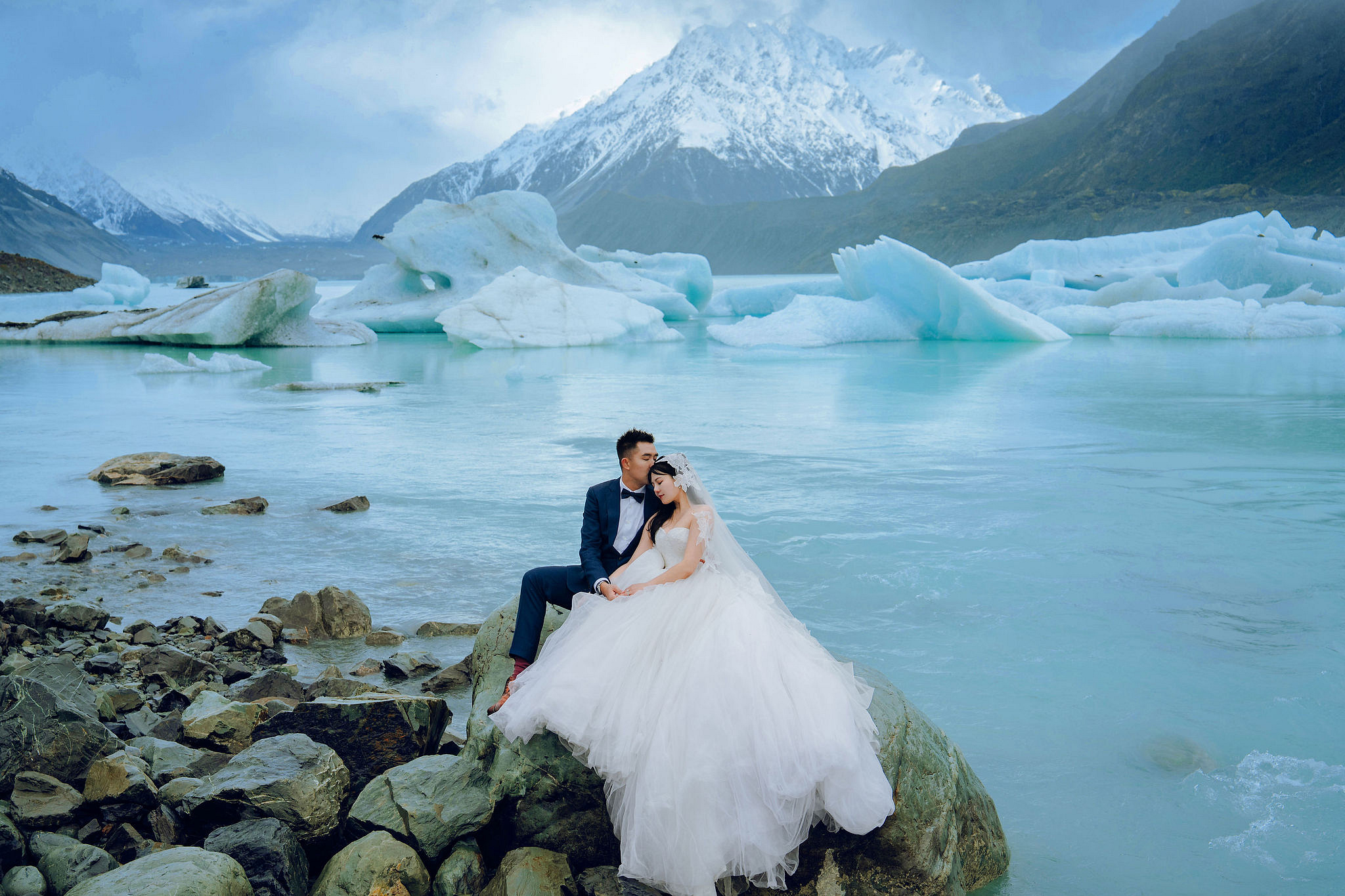 New Zealand Pre-Wedding Photoshoot | Lake Tekapo, Mount Cook, Tasman Glacier & Lake Wakatipu at Glacier Lake pre-wedding photo