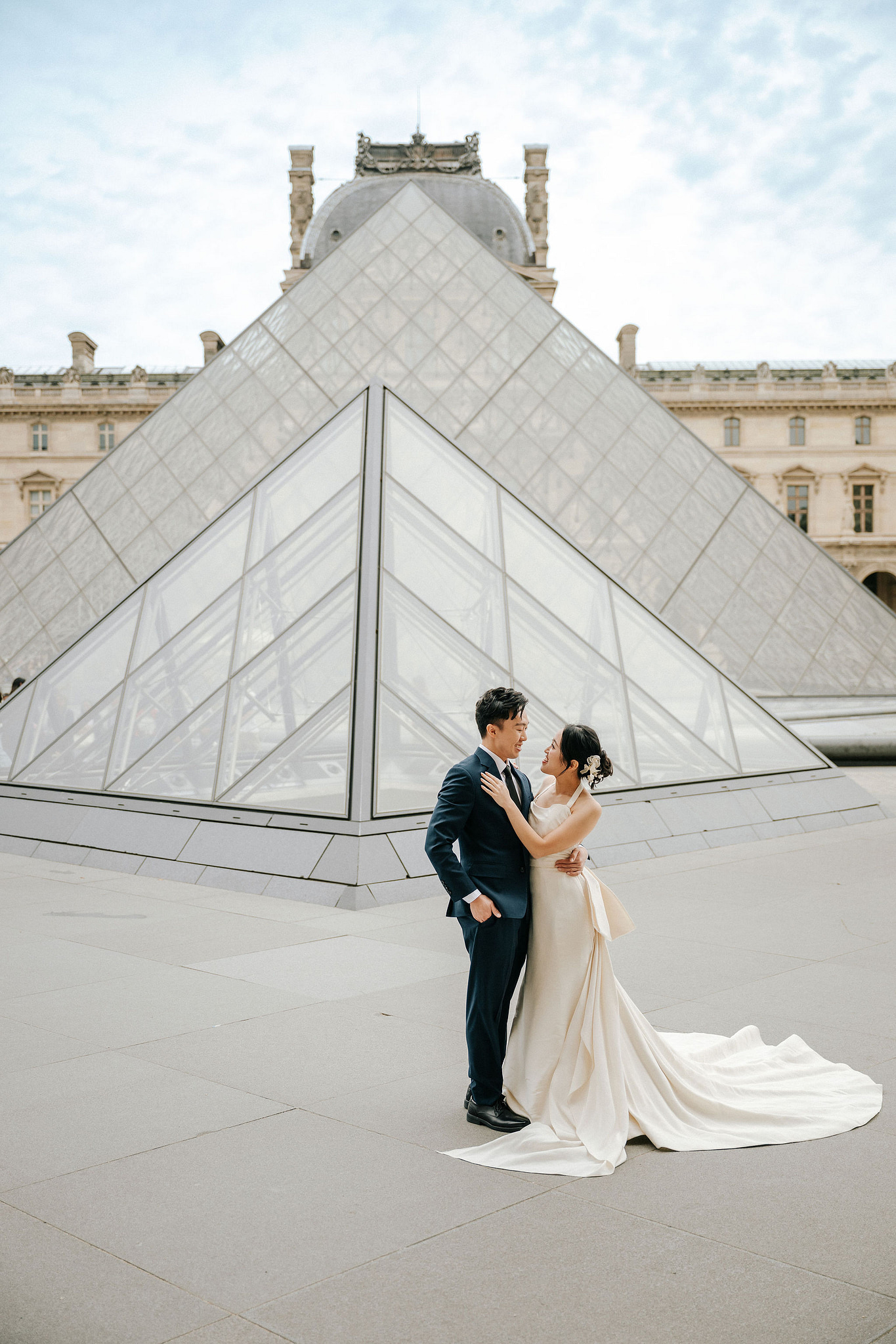 Paris Pre-Wedding Photoshoot | Place du Trocadéro, Bir-Hakeim Bridge, Louvre Pyramid, Tuileries Garden & Montmartre at Louvre Pyramid pre-wedding photo