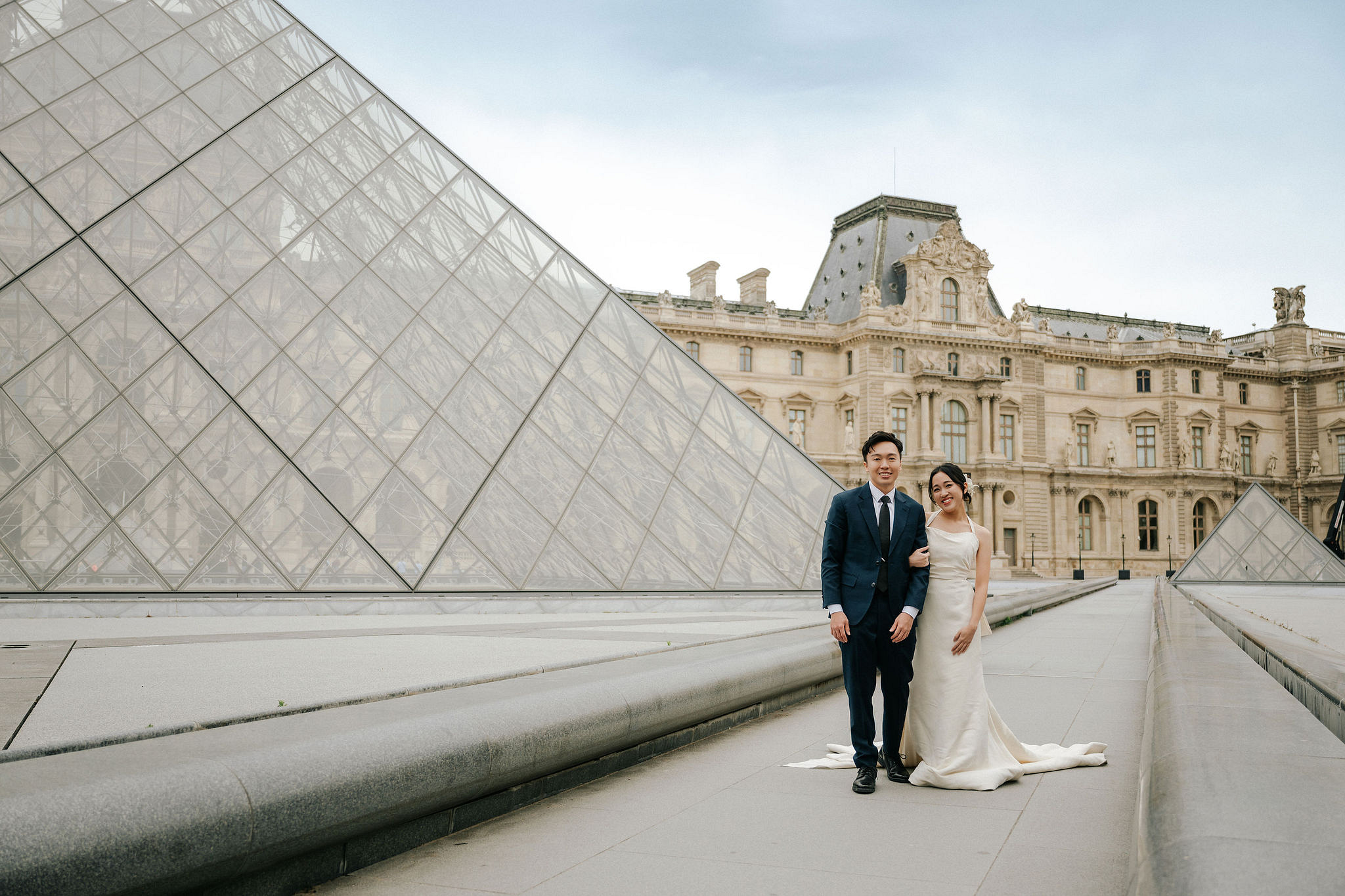 Paris Pre-Wedding Photoshoot | Place du Trocadéro, Bir-Hakeim Bridge, Louvre Pyramid, Tuileries Garden & Montmartre at Louvre Pyramid pre-wedding photo