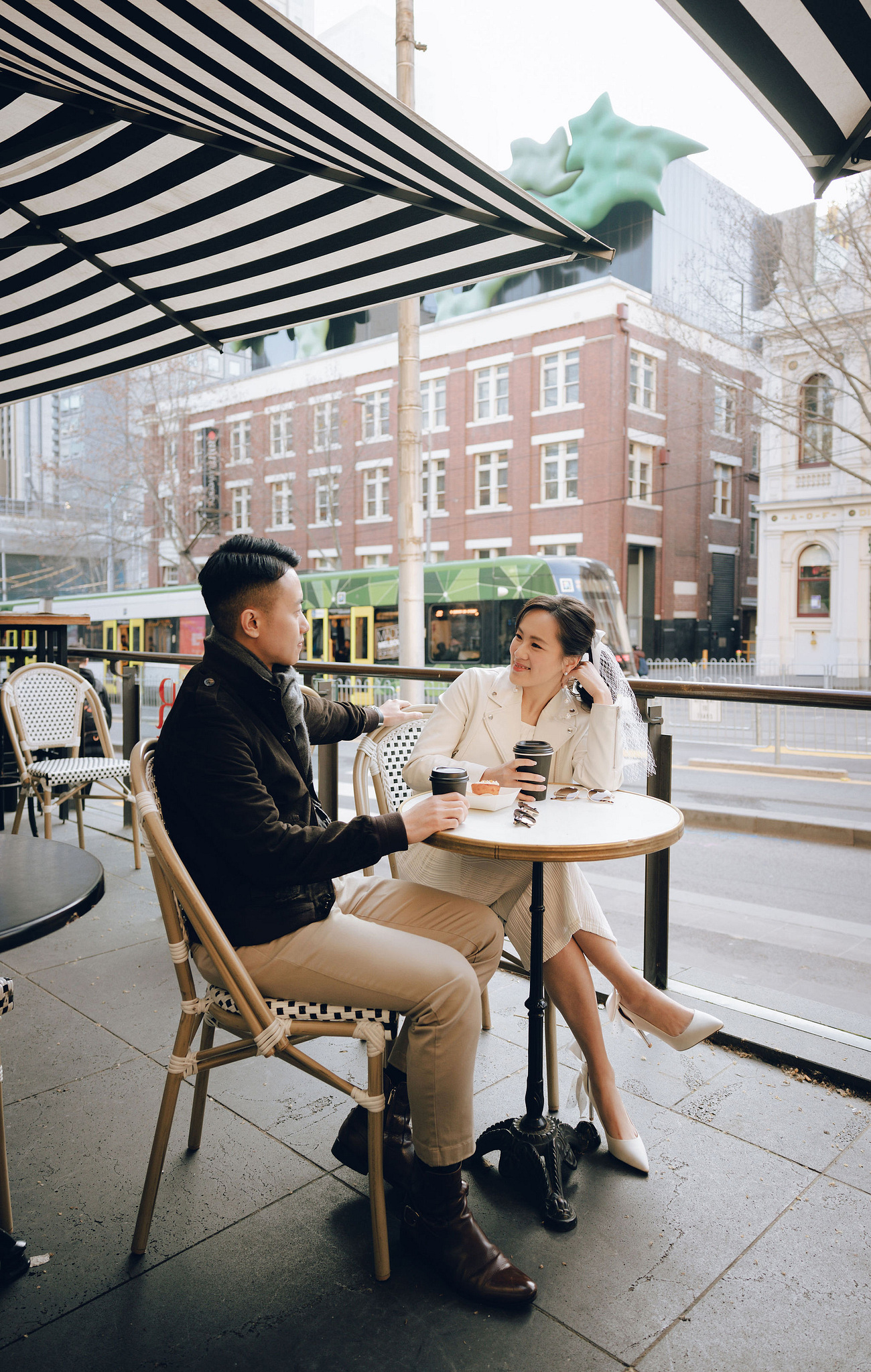 Melbourne Pre-Wedding Photoshoot | Cafe, Redwood Forest, City Streets & Carlton Gardens at City Cafe pre-wedding photo