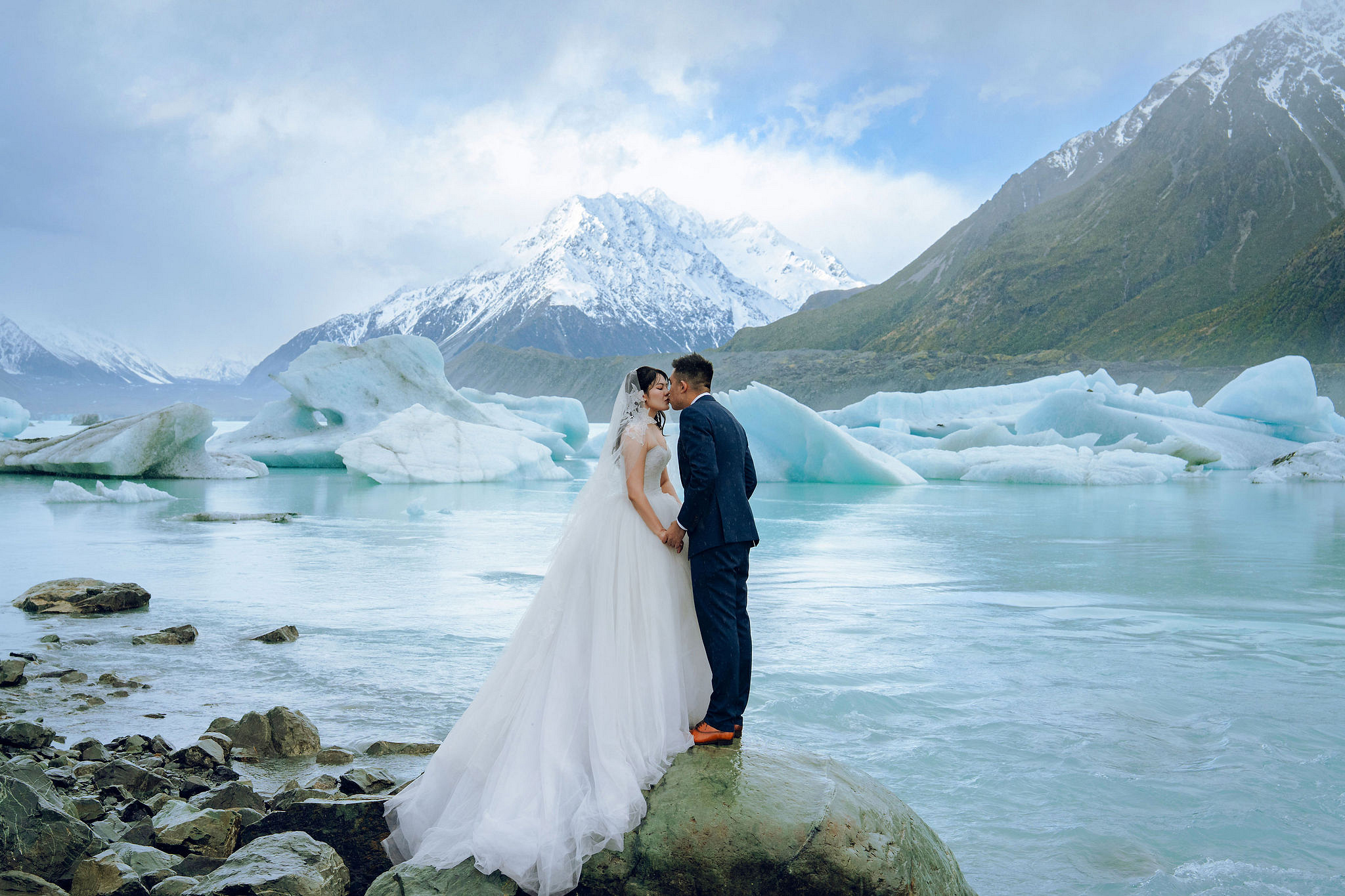 New Zealand Pre-Wedding Photoshoot | Lake Tekapo, Mount Cook, Tasman Glacier & Lake Wakatipu at Glacier Lake pre-wedding photo