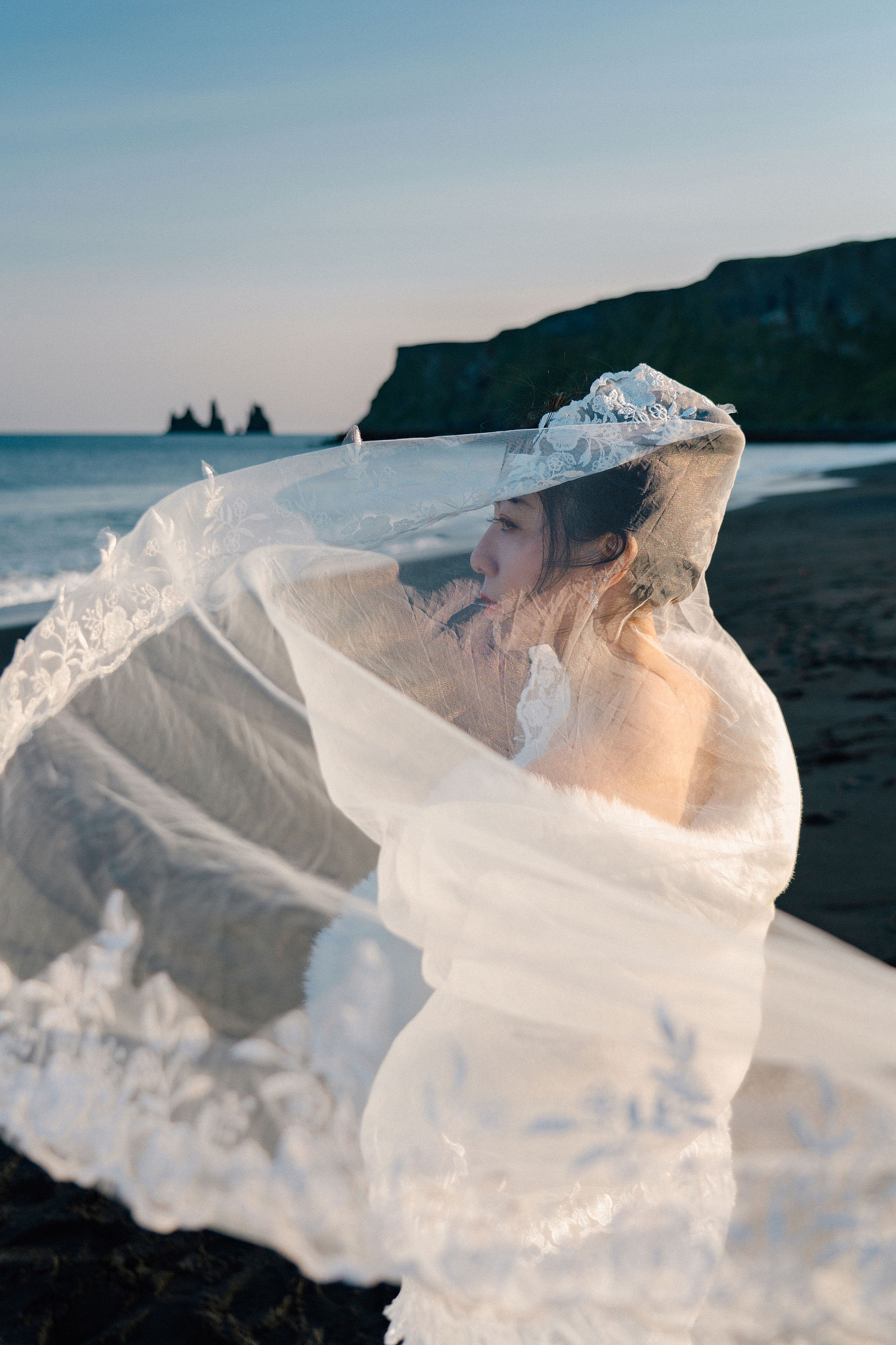 Iceland Pre-Wedding Photoshoot | Hallgrimskirkja, Skogafoss, DC Plane Wreck & Black Sand Beach at Black Sand Beach & Vik Church pre-wedding photo