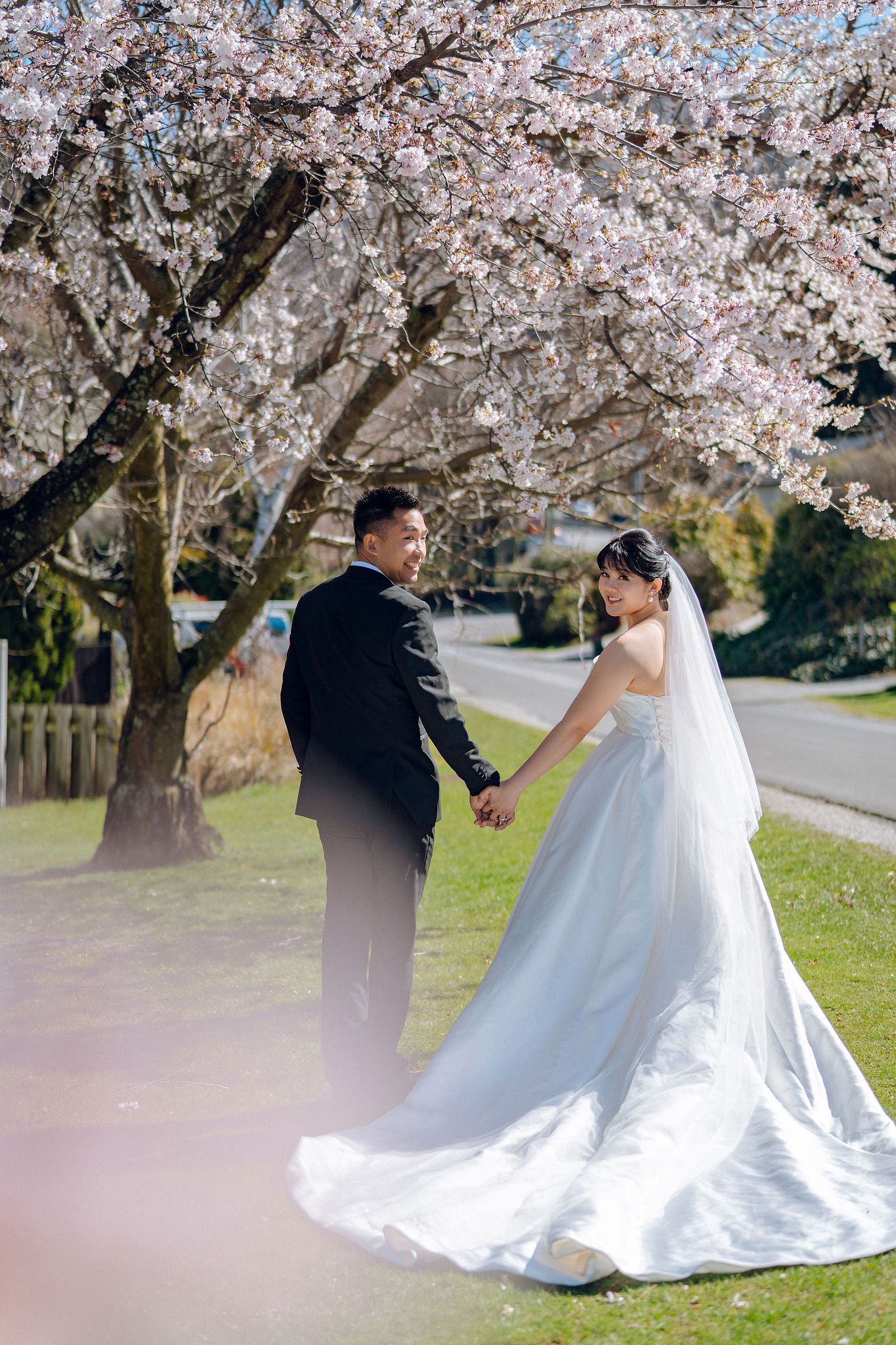 New Zealand Pre-Wedding Photoshoot | Lake Tekapo, Mount Cook, Tasman Glacier & Lake Wakatipu at Spring Blossom Path pre-wedding photo