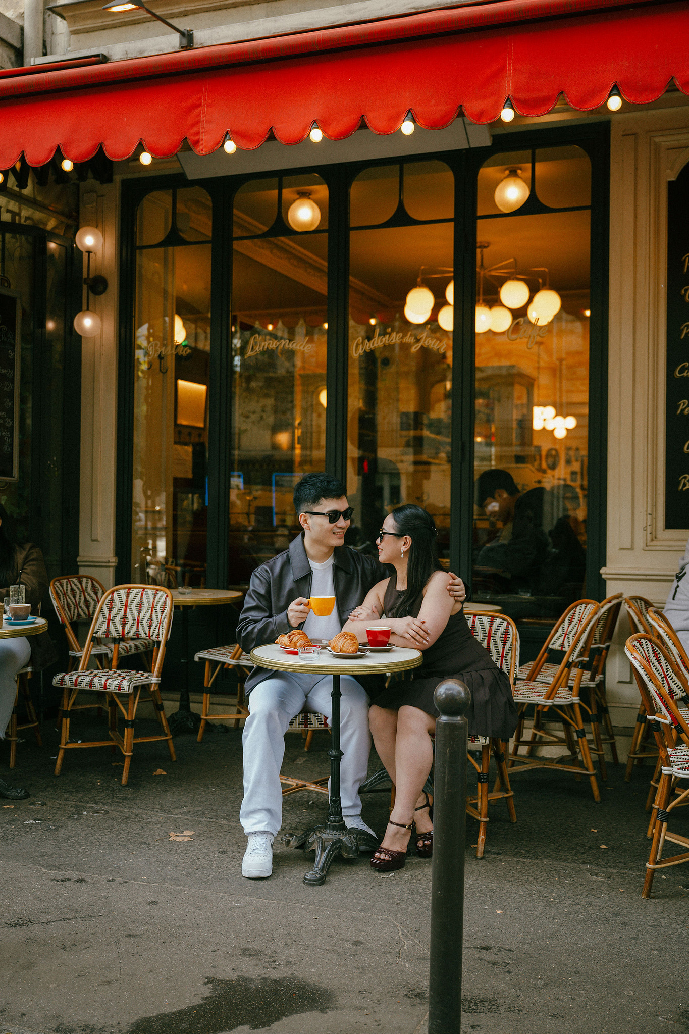 Paris Pre-Wedding Photoshoot | Trocadéro, Vintage Car, Parisian Café, Paris Rooftop & Louvre at Parisian Café pre-wedding photo