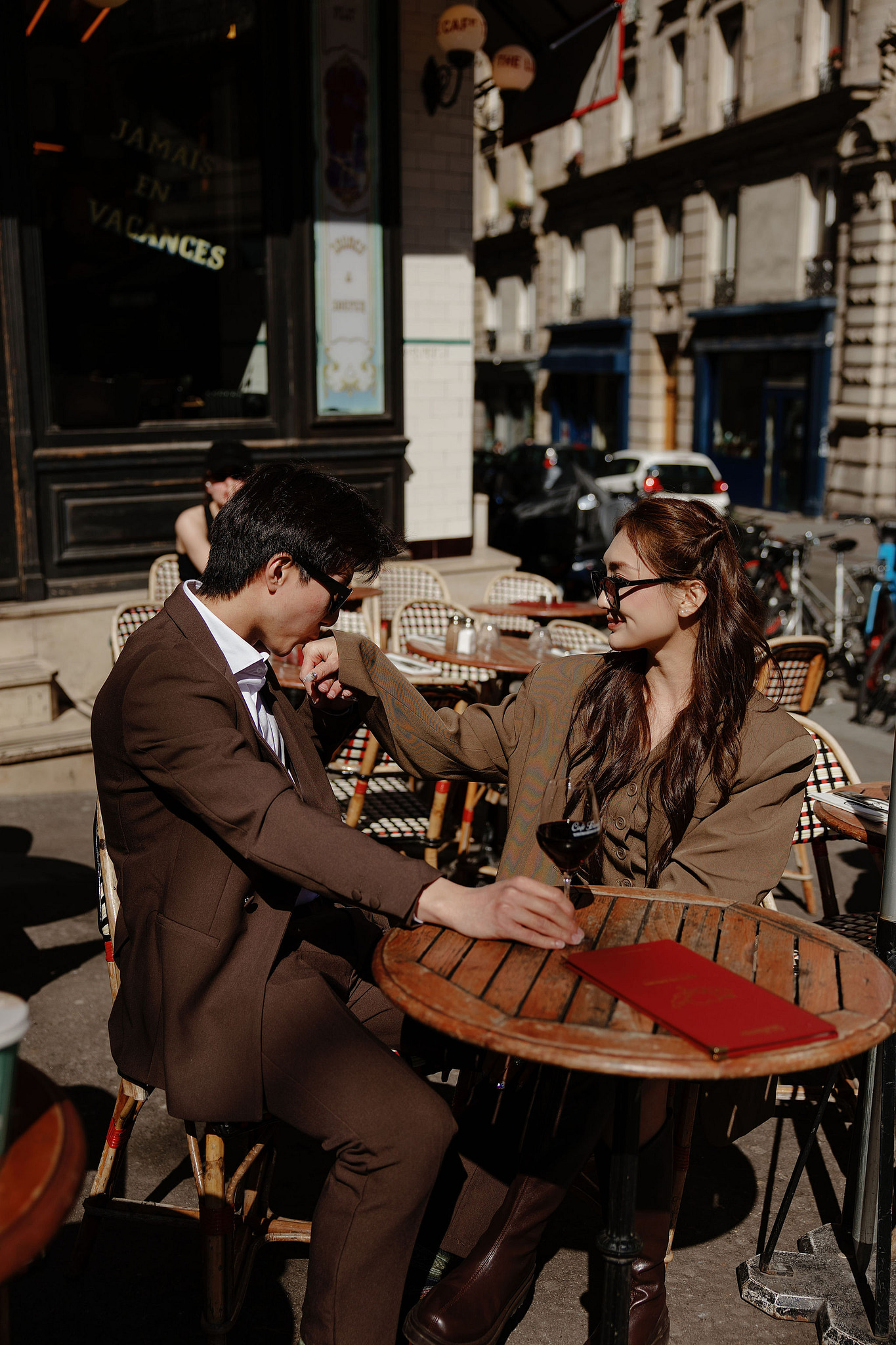 Paris Pre-Wedding Photoshoot | Place du Trocadéro, Bir-Hakeim Bridge, Sacré-Cœur Basilica, Parisian Café & Palais Royal at Parisian Café pre-wedding photo