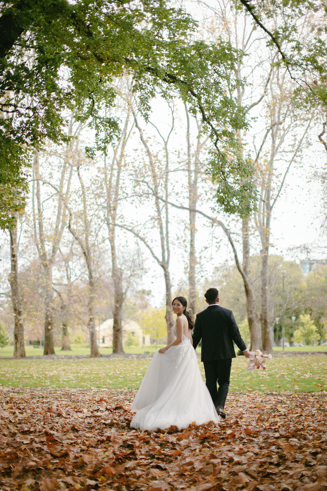 Melbourne Pre-Wedding Photoshoot | Parliament House, Fitzroy Gardens, Melbourne Streets & Half Moon Bay at Fitzroy Gardens pre-wedding photo