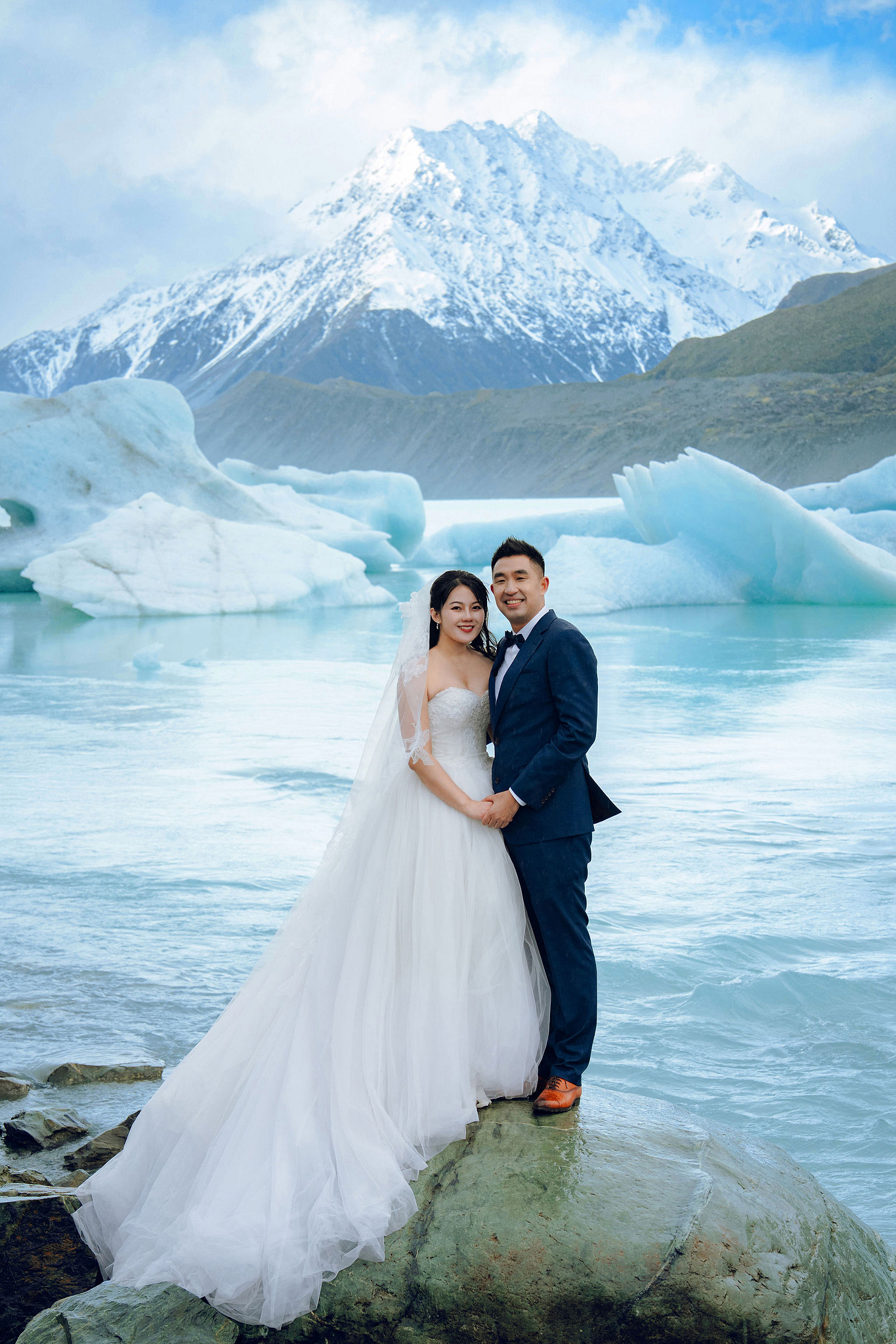 New Zealand Pre-Wedding Photoshoot | Lake Tekapo, Mount Cook, Tasman Glacier & Lake Wakatipu at Glacier Lake pre-wedding photo