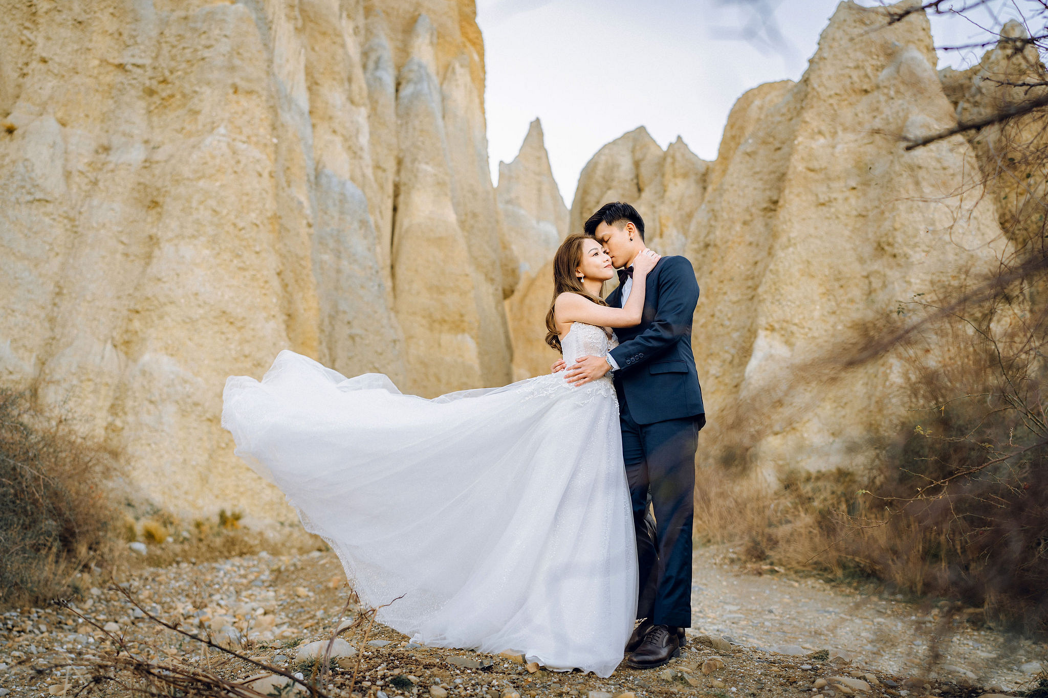 New Zealand Pre-Wedding Photoshoot | Alpaca Farm, Mt John, Lake Tekapo, Mount Cook National Park, Glacier Lake & Omarama Clay Cliffs at Omarama Clay Cliffs pre-wedding photo