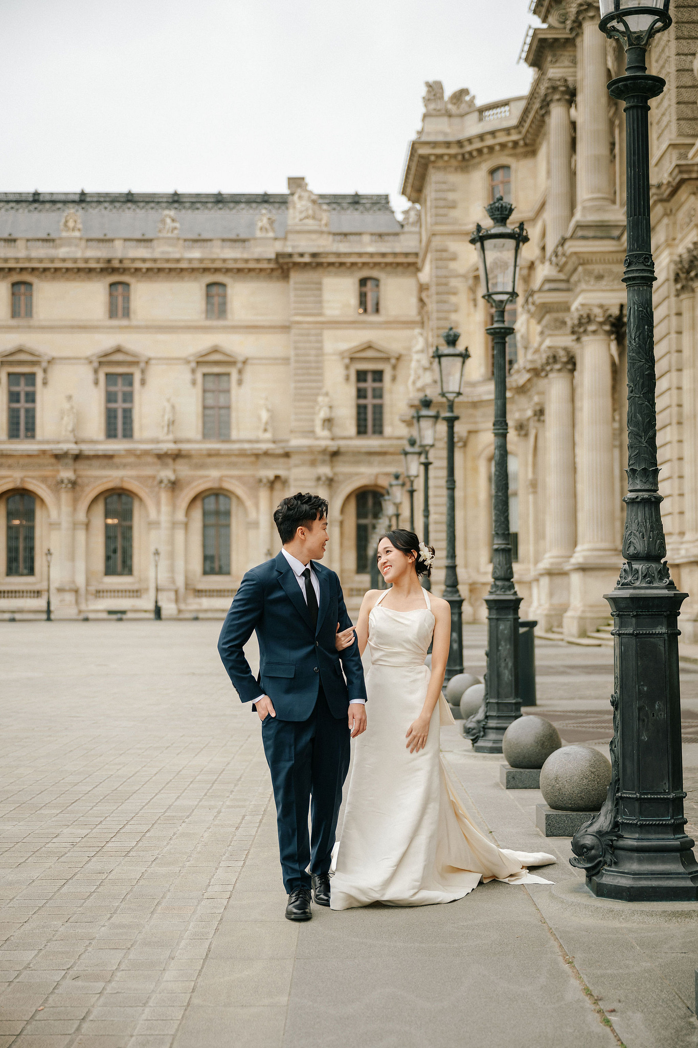 Paris Pre-Wedding Photoshoot | Place du Trocadéro, Bir-Hakeim Bridge, Louvre Pyramid, Tuileries Garden & Montmartre at Louvre Pyramid pre-wedding photo