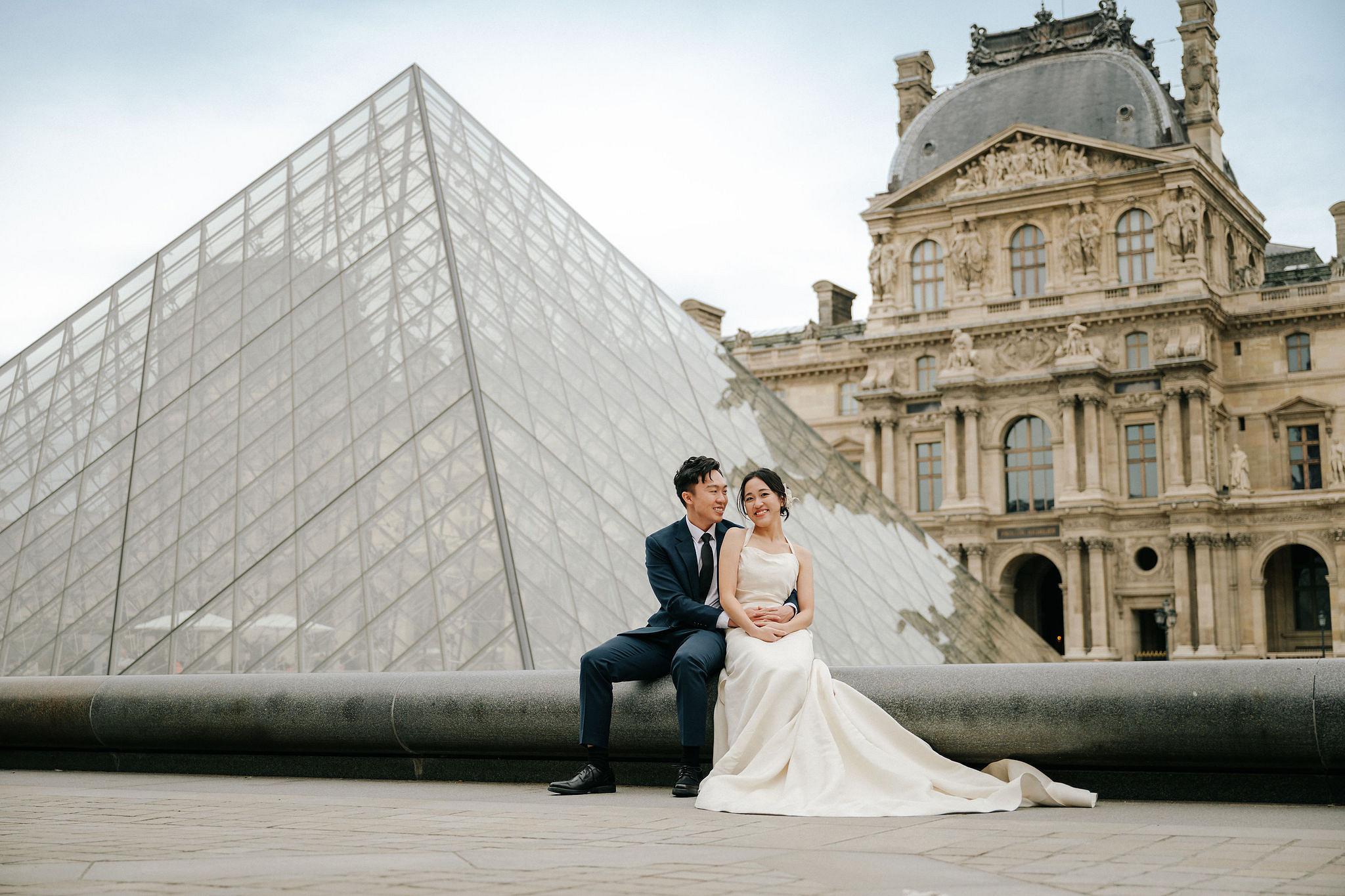 Paris Pre-Wedding Photoshoot | Place du Trocadéro, Bir-Hakeim Bridge, Louvre Pyramid, Tuileries Garden & Montmartre at Louvre Pyramid pre-wedding photo