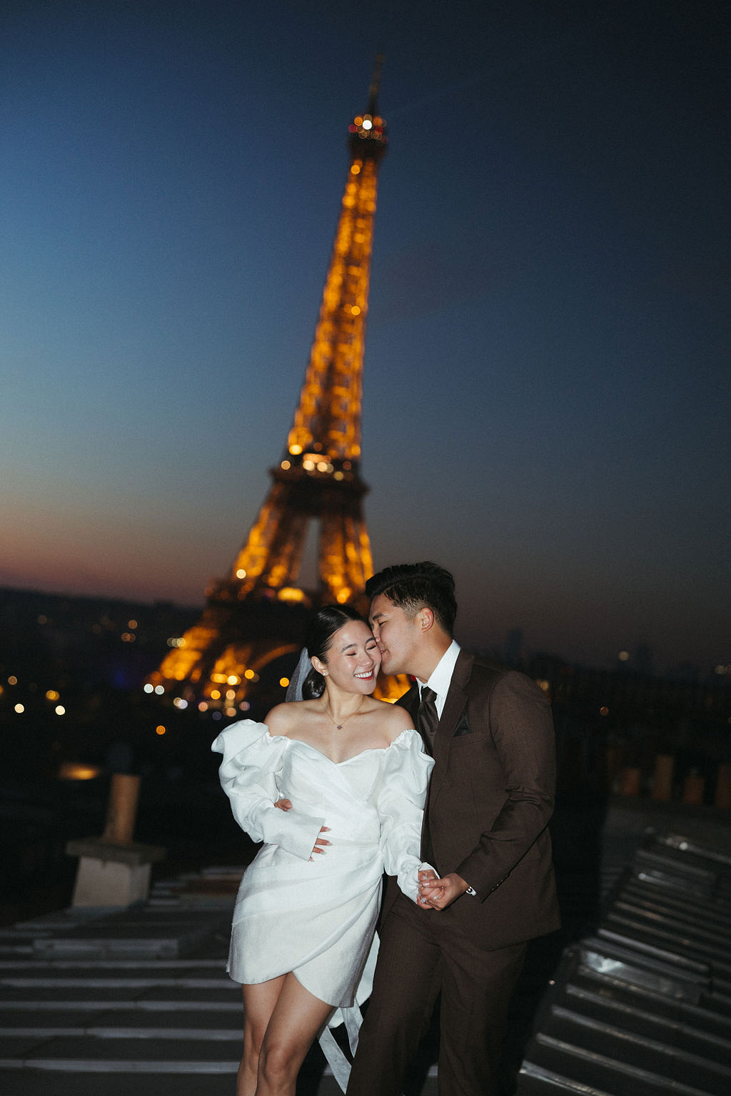Paris Pre-Wedding Photoshoot with Eiﬀel Tower Louvre Museum Parisian Cafe Vintage Car Rooftop Night at Paris Rooftop pre-wedding photo