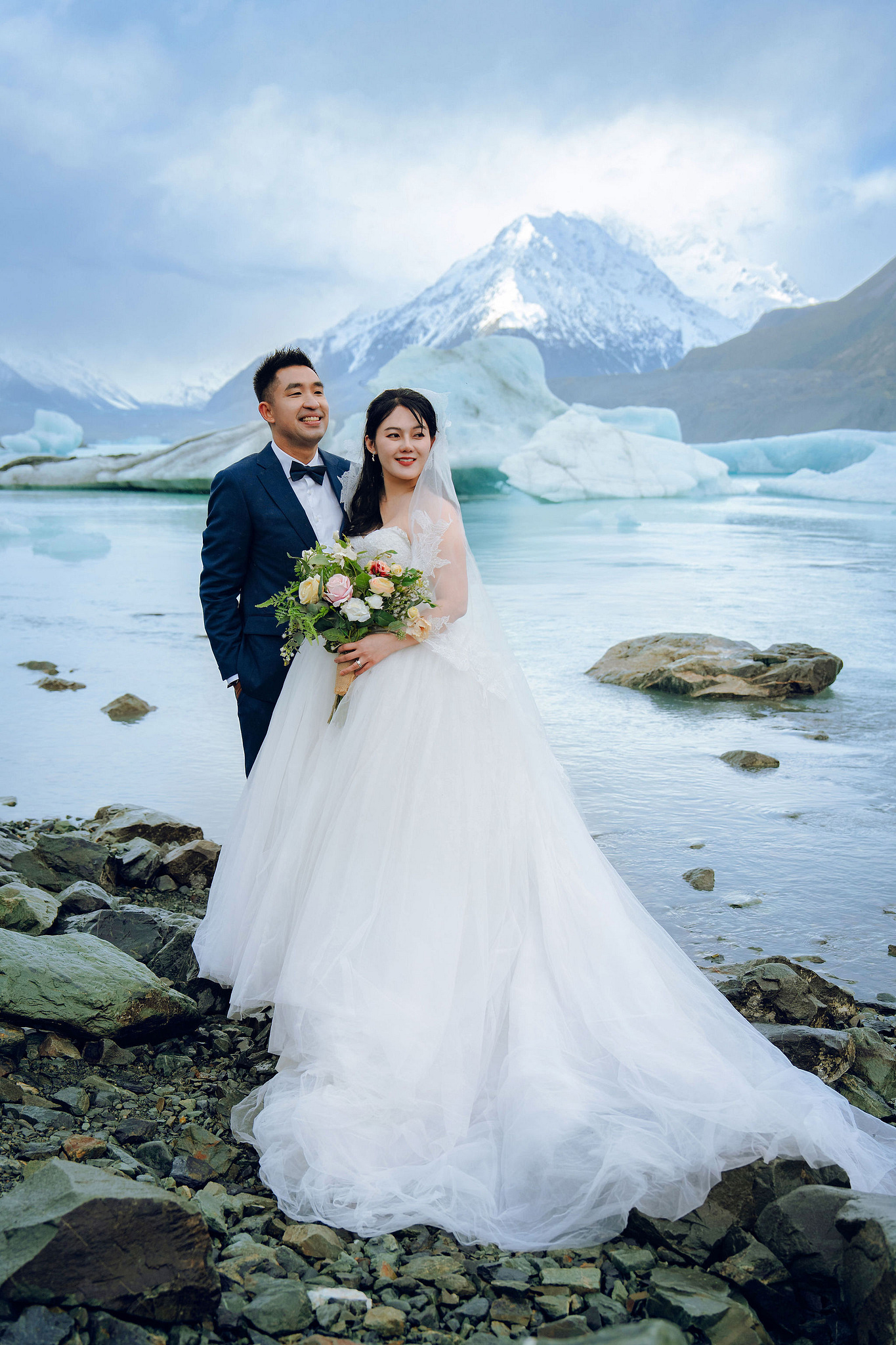 New Zealand Pre-Wedding Photoshoot | Lake Tekapo, Mount Cook, Tasman Glacier & Lake Wakatipu at Glacier Lake pre-wedding photo