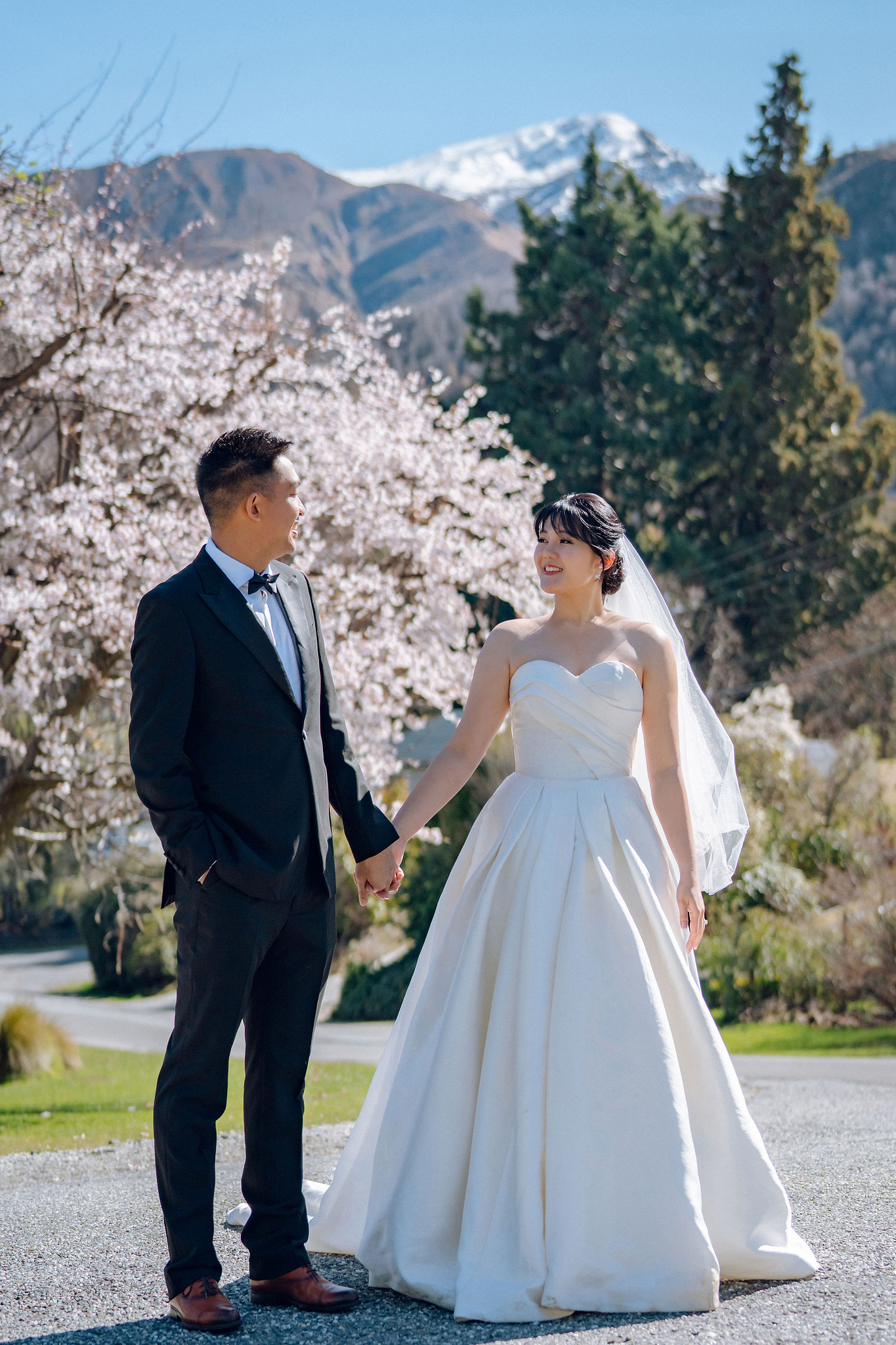 New Zealand Pre-Wedding Photoshoot | Lake Tekapo, Mount Cook, Tasman Glacier & Lake Wakatipu at Spring Blossom Path pre-wedding photo