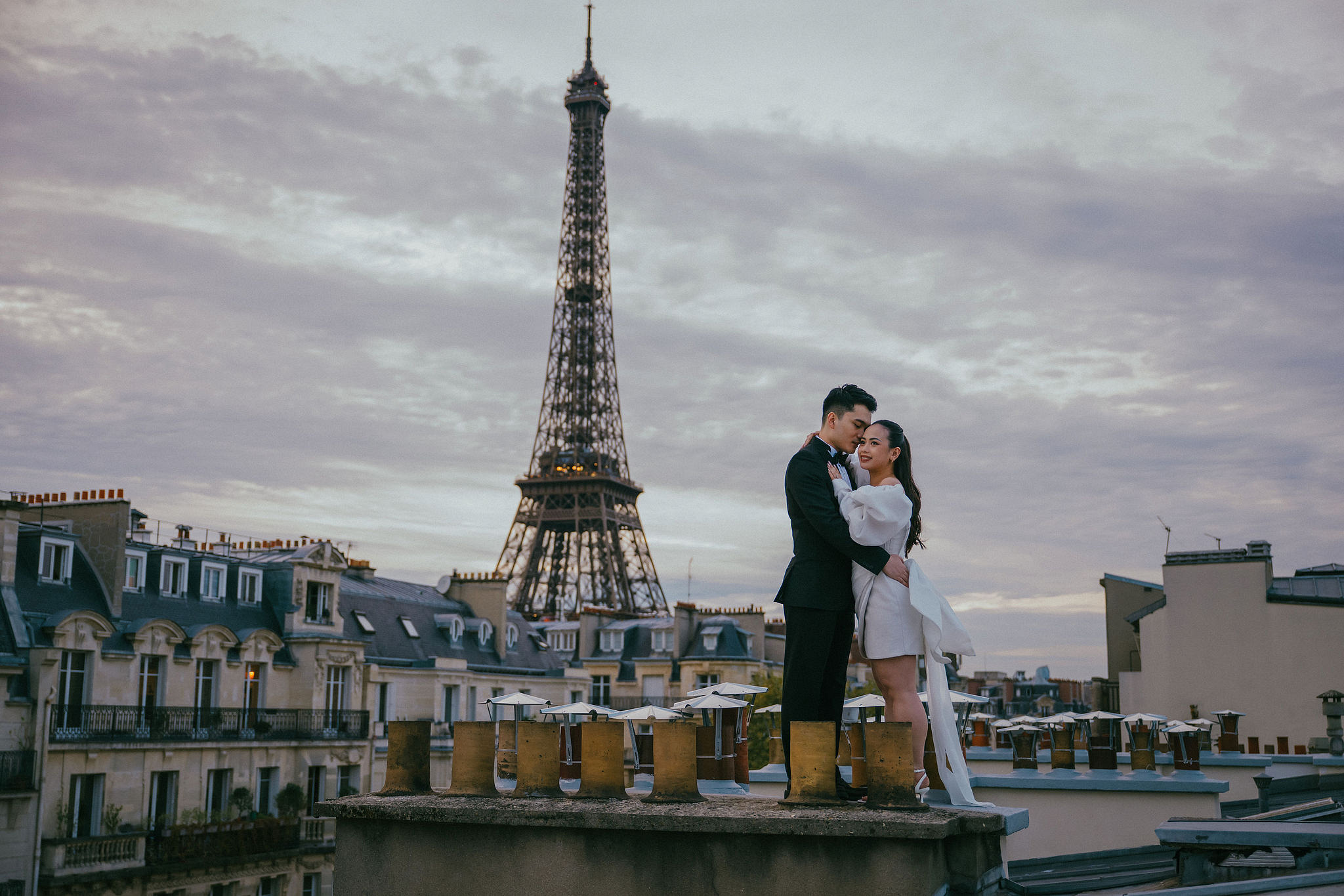Paris Pre-Wedding Photoshoot | Trocadéro, Vintage Car, Parisian Café, Paris Rooftop & Louvre at Paris Rooftop pre-wedding photo