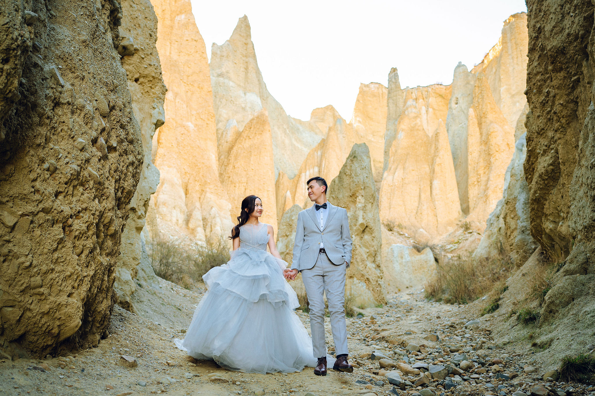 New Zealand Pre-Wedding Photoshoot with Lake Wakatipu, Skippers Canyon, Lake Tekapo, Mount Cook, and Omarama Clay Cliffs at Omarama Clay Cliffs pre-wedding photo