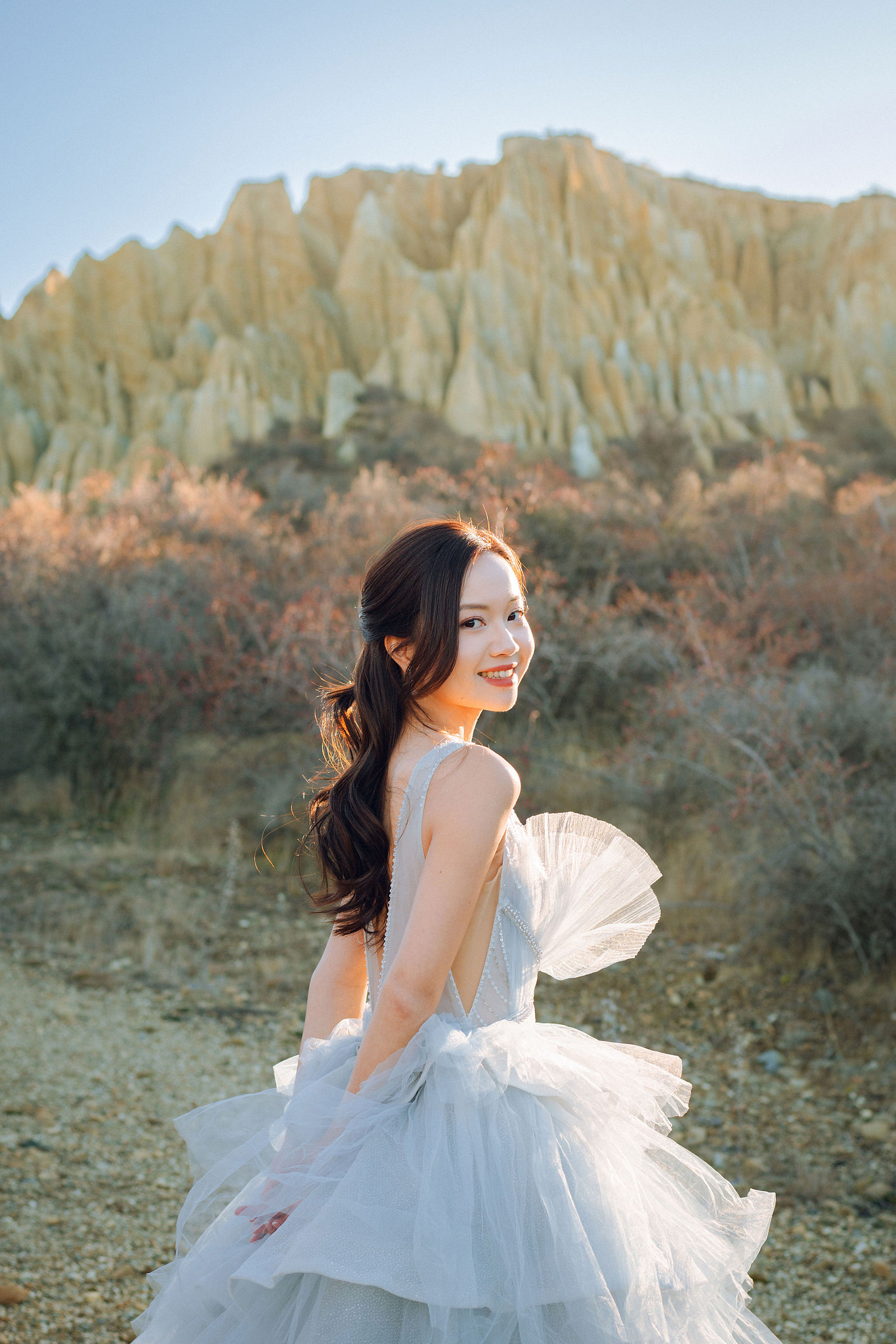New Zealand Pre-Wedding Photoshoot with Lake Wakatipu, Skippers Canyon, Lake Tekapo, Mount Cook, and Omarama Clay Cliffs at Omarama Clay Cliffs pre-wedding photo