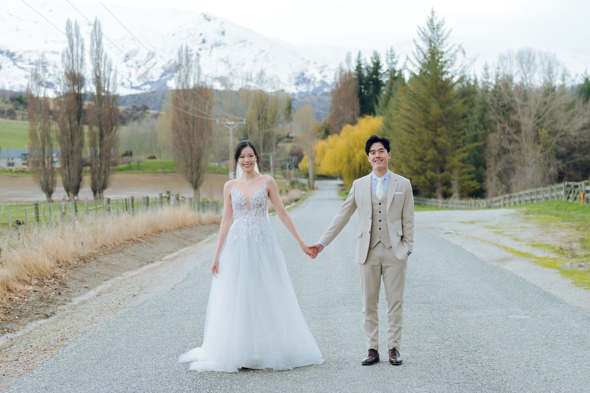 New Zealand Pre-Wedding Photoshoot | Cherry Blossoms, Coromandel Peak & Lake Wakatipu at Lake Wakatipu & Queenstown Highway pre-wedding photo