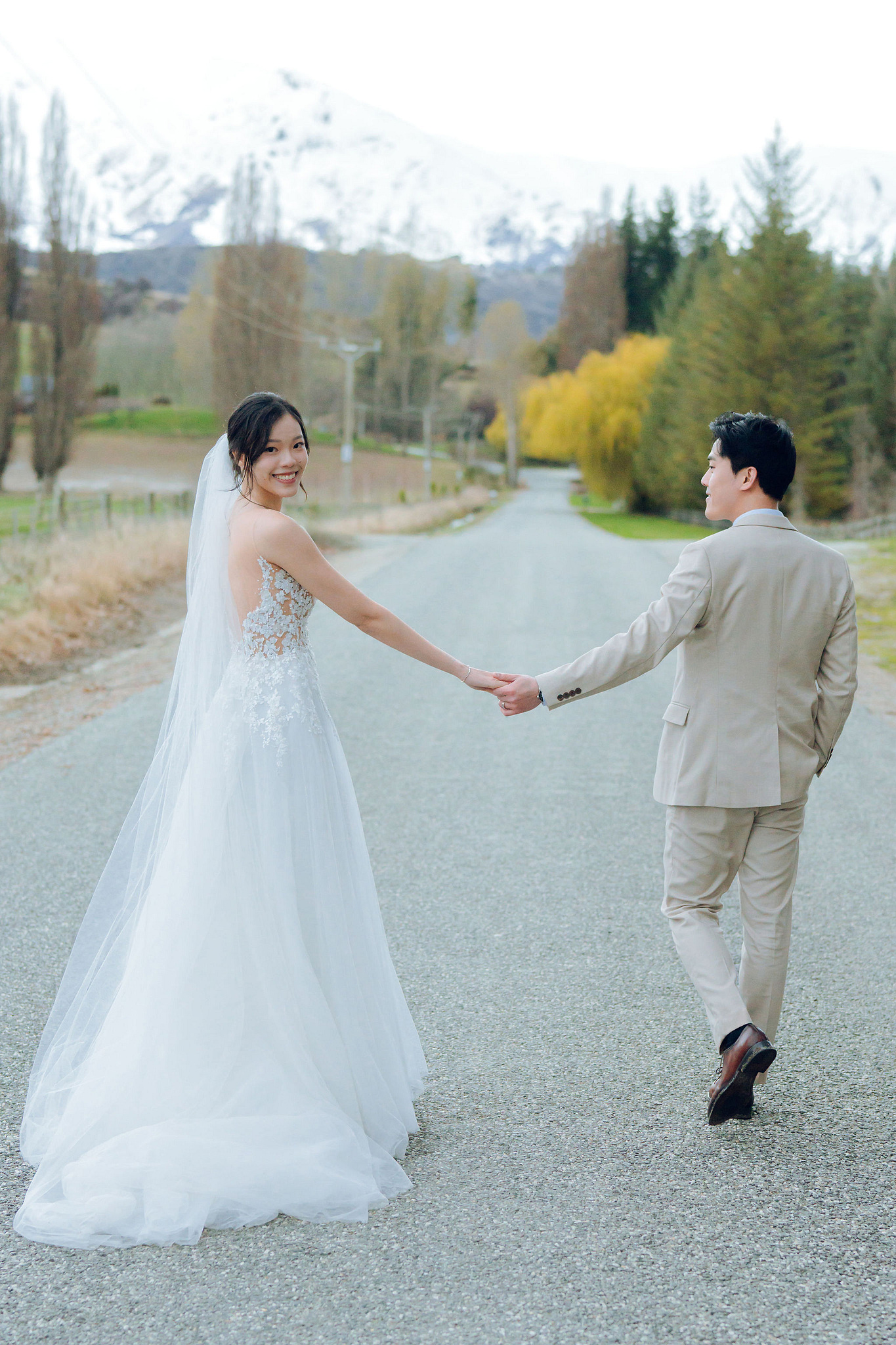 New Zealand Pre-Wedding Photoshoot | Cherry Blossoms, Coromandel Peak & Lake Wakatipu at Lake Wakatipu & Queenstown Highway pre-wedding photo