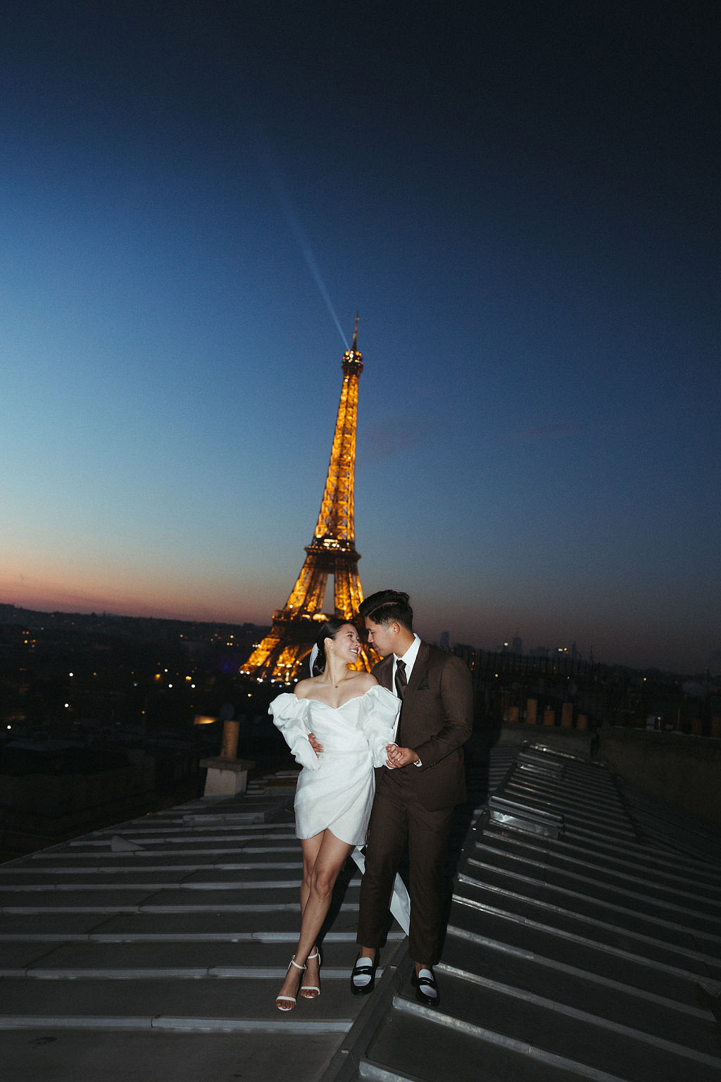Paris Pre-Wedding Photoshoot with Eiﬀel Tower Louvre Museum Parisian Cafe Vintage Car Rooftop Night at Paris Rooftop pre-wedding photo